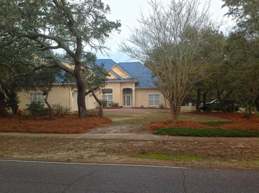 Ideal Family home a corner lot in highly sought Indian Bayou. This home features concrete exterior walls metal roof and hurricane shutters. Grand entry with 13' ceiling breakfast area and separate dining room. Three large bedrooms on the ground floor master suite incudes a large walk in closet. There is a large room on the second floor that is perfect for a Mother in law suite or study.Home is as energy efficient as they come, also features a propane generator. Large price reduction.