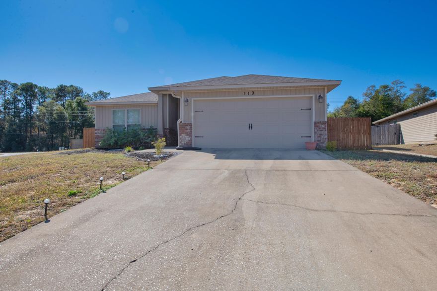 Better than new with oversized lot home, located South of I10 in Crestview! This home offers an open floor plan with a large eat in kitchen, stainless steel appliances, granite countertops, well sized living and dining area, spacious primary bedroom with ensuite bathroom, separate shower, garden tub, double vanities, and walk in closet! The home also features a fenced backyard as well as a covered back porch. This home offers a laundry room inside & a two car garage for additional parking, along with a large driveway. Schedule your showing today!