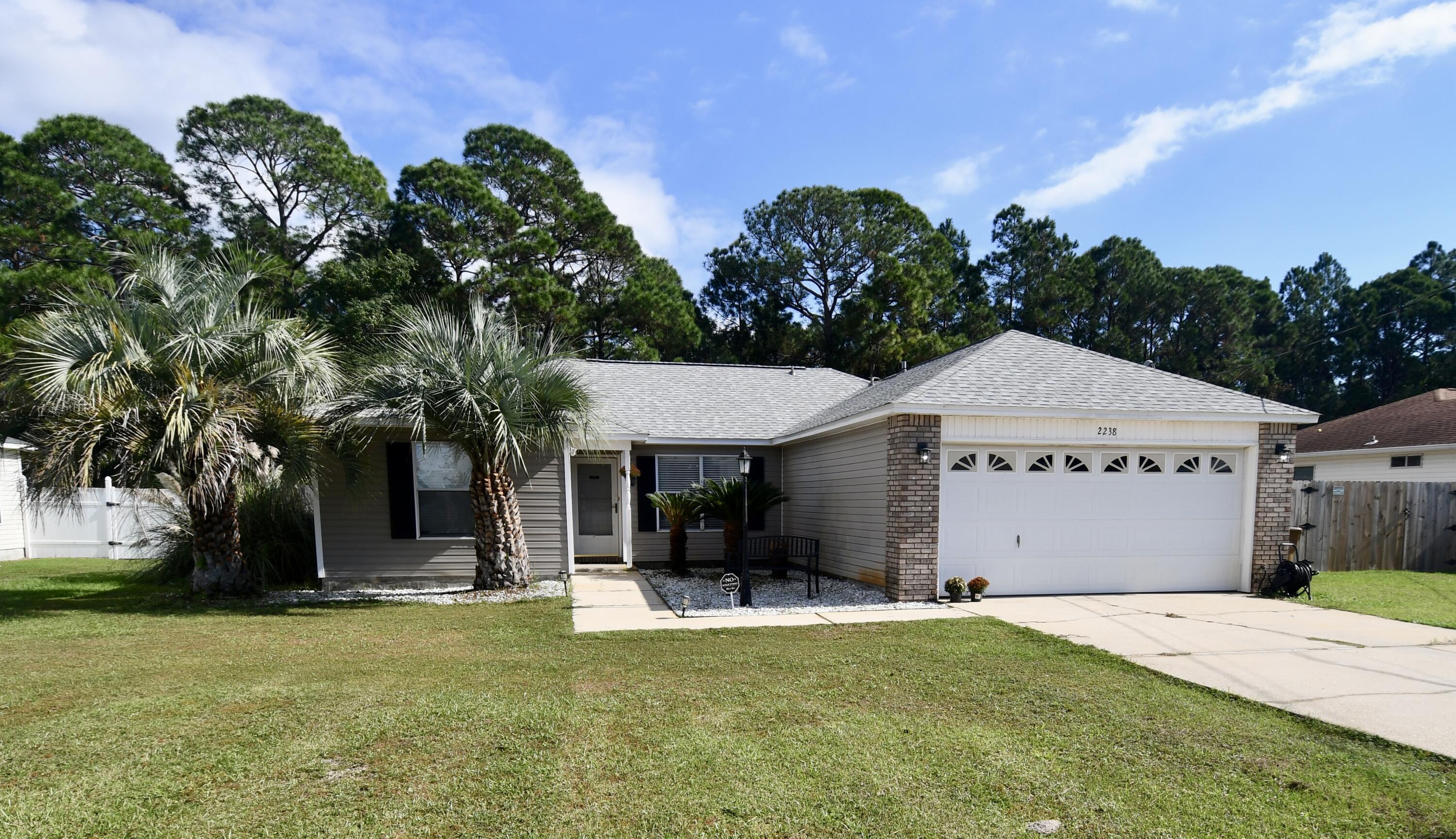 This 3/2 is conveniently located on Whispering Pines in East Navarre. Easy access to base, beaches, and retail. New Roof and New Hot Water Heater in 2024, HVAC 2017. New Windows in 2022, Brand new carpet in Master Bedroom, New LVP in Living/Dining and other 2 bedrooms. Sellers have recent Wind Mit and 4-Point they are willing to share. Large back yard is fenced in with Chicken Run/Coop and Shed (all to convey). No HOA!