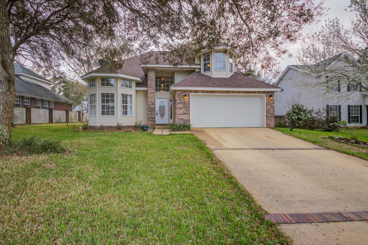 Cul de sac home in a gated community in Bluewater Bay, just behind the elementary school with *5* Bedrooms, renovated kitchen and baths, fenced-in yard for play, AND 2 living spaces - This home has everything you are looking for and more! From the front entry you are greeted with a large living room off to the left, beautiful staircase with walnut stained hardwood treads and new banister. Straight off the foyer is a hallway into the renovated kitchen with granite counter tops, top of the line appliances- including a dual fuel range, convection microwave, Bosch Dishwasher, and eating nook that overlooks the den in the rear of the home. Off this main living space are french doors to the fenced-in backyard and newly replaced over sized deck, great for entertaining! On the other side of the kitchen is an over sized dining room that could be used an as office - also equipped with french door that exits to the backyard.
Upstairs are 5 bedrooms, one in particular would make a fabulous nursery or secondary office space. At the top of the stairway there is an renovated hall bathroom with a tiled tub/shower surround and new toilet. Four additional bedrooms all good sized and each with an ample sized closet. One bedroom in particular has two exits, one from the master suite and the other from the hallway, this room could easily be a nursery, game room or study.
The master bedroom is behind double doors allowing for privacy, a true quiet space. This room has ample size for a king bed and two dressers. The walk-in closet has built in shelving, and an entrance into the well appointed renovated master bath. The 72 inch tub is phenomenal! Dual sinks, tile floors, tiled walk in shower and dual flush toilet.
The laundry room is downstairs - beautifully decorated with wainscoting, ample space for hanging laundry and a door that exits into the two car garage. Pull down attic stairs in hallway upstairs allows for storage.
2016 Roof, 2009 HVAC, Nest Thermostat, and the Seller will allow a $3,000 allowance for new sod or carpet with accepted contract.