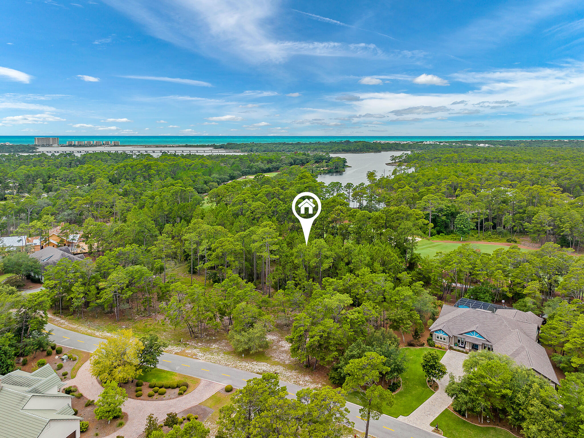 Unique idyllic homesite now available in Northwest Florida Beach Community for Golf and Nature enthusiast. This large (.98 of an acre) parcel is located within the serene private gate guarded community of Wild Heron and backs up to the manicured 12th green on the acclaimed Greg Norman designed Sharks Tooth Golf Course with views of picturesque Lake Powell. Wild Heron boasts 734 pristine acres and is situated on the protected shores of coastal dune Lake Powell which feeds directly into the gulf, and is adjacent to one of the most beautiful beaches in the country. The parcel is within walking distance to the Sharks Tooth Clubhouse with multiple dining venues, and the practice "driving" range.
This 12th hole lot with Lake Powell water views is just under one acre located on Sharks Tooth golf course, a Greg Norman designed masterpiece and two other golf courses including Watersound, and a new 18 hole golf course coming soon. Overlooking Lake Powell, Florida's largest coastal dune lake and just minutes away from the Gulf of Mexico this charming community offers a plethora of amenities which include a pool, hot tub, state of the art fitness center, dock, boathouse with kayaks and canoes, boardwalk by Lake Powell, and nature trails. The community is conveniently located near the best dining along 30Avenue and Rosemary Beach unique boutique shopping, bike paths and lake access for boating.