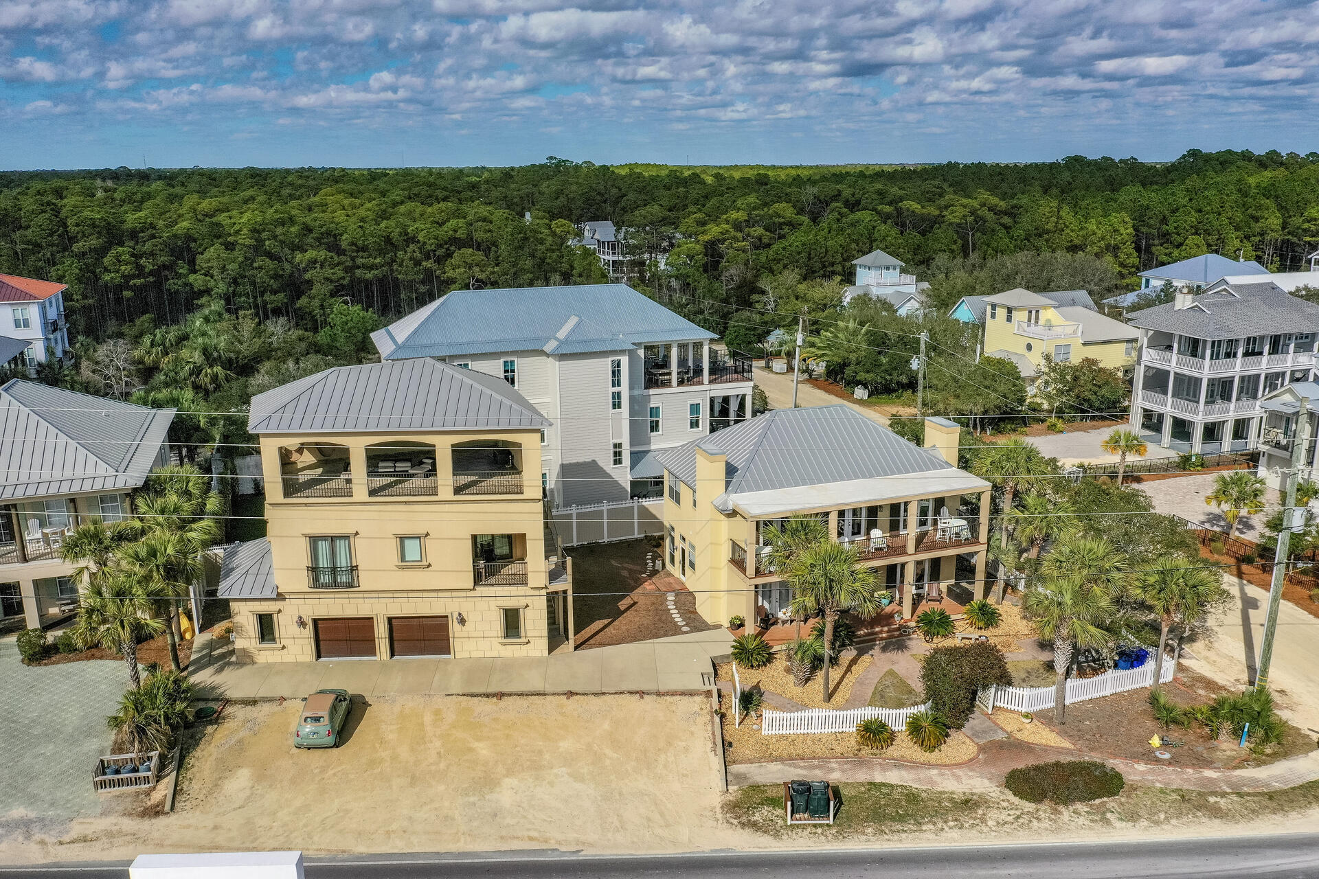 WOW! A very unique property in Seagrove Beach affords the new owner to use both houses on the property as rental or family gatherings. The main house is presently operated as The Seagrove Inn. Charming and inviting the main house has 5 bedrooms each with its own ensuite bath. The spacious kitchen has a chefs commercial gas range, over-sized granite island and large dining area. Decks off the second floor offer an opportunity to enjoy the Gulf and sea breezes. Directly across 30A and only a few steps to the public beach access to Bramble Beach. The other house on the property is a 3 story carriage house with a first floor having a two car garage, laundry area and office space. The 3rd floor is totally open and covered for outdoor entertaining and viewing sunsets over the Gulf.