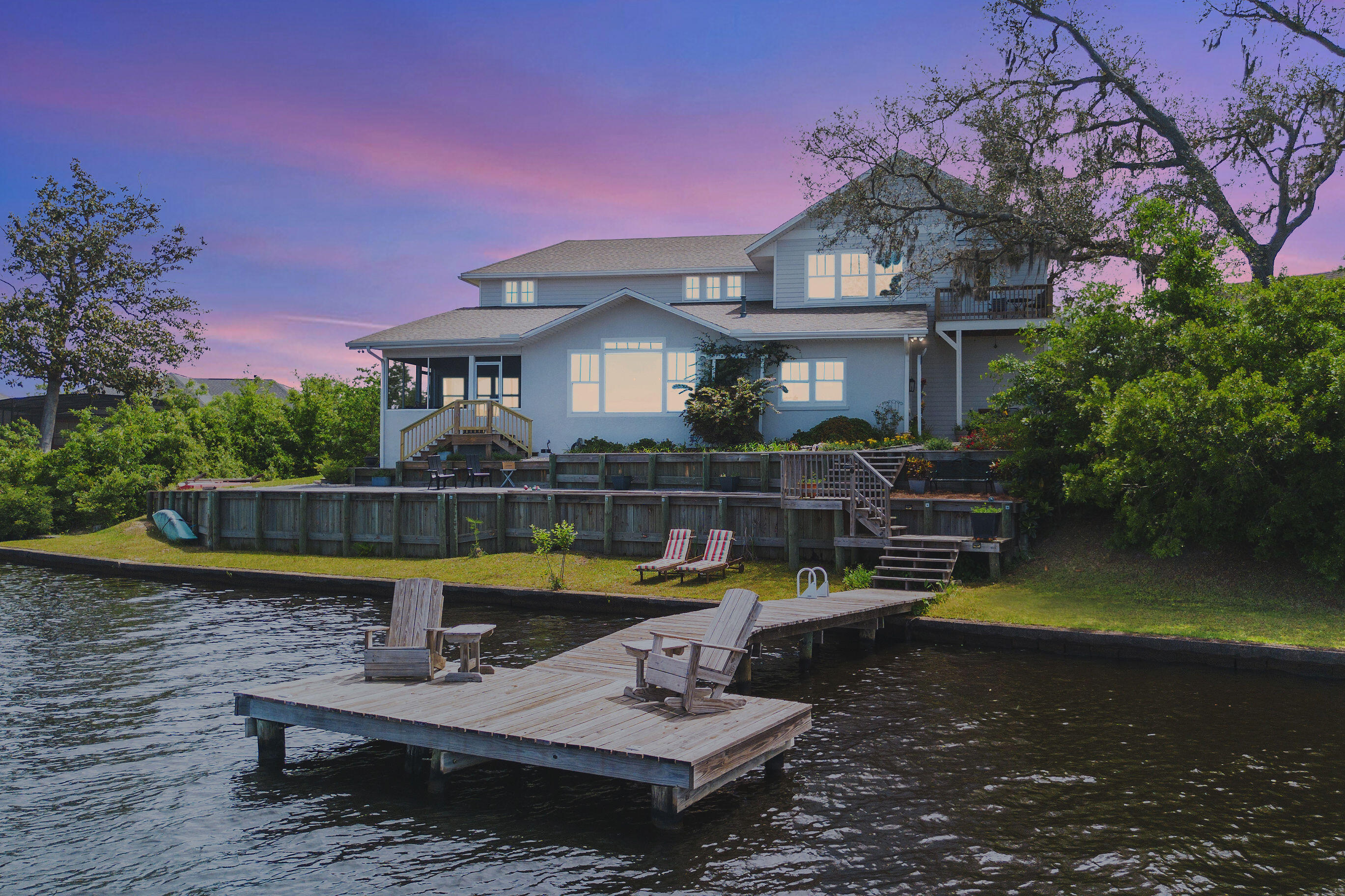 A home unlike any other. One so close to the water's edge, it appears to be floating. A lush backyard out of a fairytale. Steeped in history but with a renovation and modern amenities straight out of Architectural Digest. Character. Charm. Art. Innovation. Ultimate Waterfront Living. Initially built in the 1950s, the original fish camp cottage is the heart of this home. The visionaries behind the current estate designed an iconic renovation and expansion, allowing the grandfathered proximity to the water's edge (LESS THAN 25 FEET FROM THE BACK DOOR.) All of the charm of the original home is carried throughout in a seamless renovation. Sitting on over an acre of land, the waterfront views span 152 feet and oh yes, those views do face the sunset. Come witness the magic for yourself...