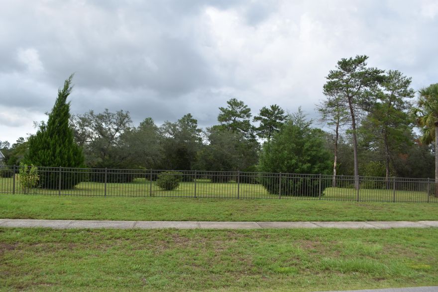 A beautifully landscaped, over-sized 2.18 acre estate lot. Build your custom dream home the sky is the limit.  This lot is located close to a back entrance to Windswept where home sites are larger lots for added privacy. This lot is improved with electricity installed and running as well as a  with a 250 ft deep water well and irrigation. The lot is improved with with beautiful aluminum fencing that can be re-positioned to separate your new property from neighboring lot. The community amenities include a large swimming pool and clubhouse, two tennis courts, basketball court, and a safe playground facility. The natural topography of the sweeping sand dunes provides a sense of privacy between the homes and the well-maintained golf course.