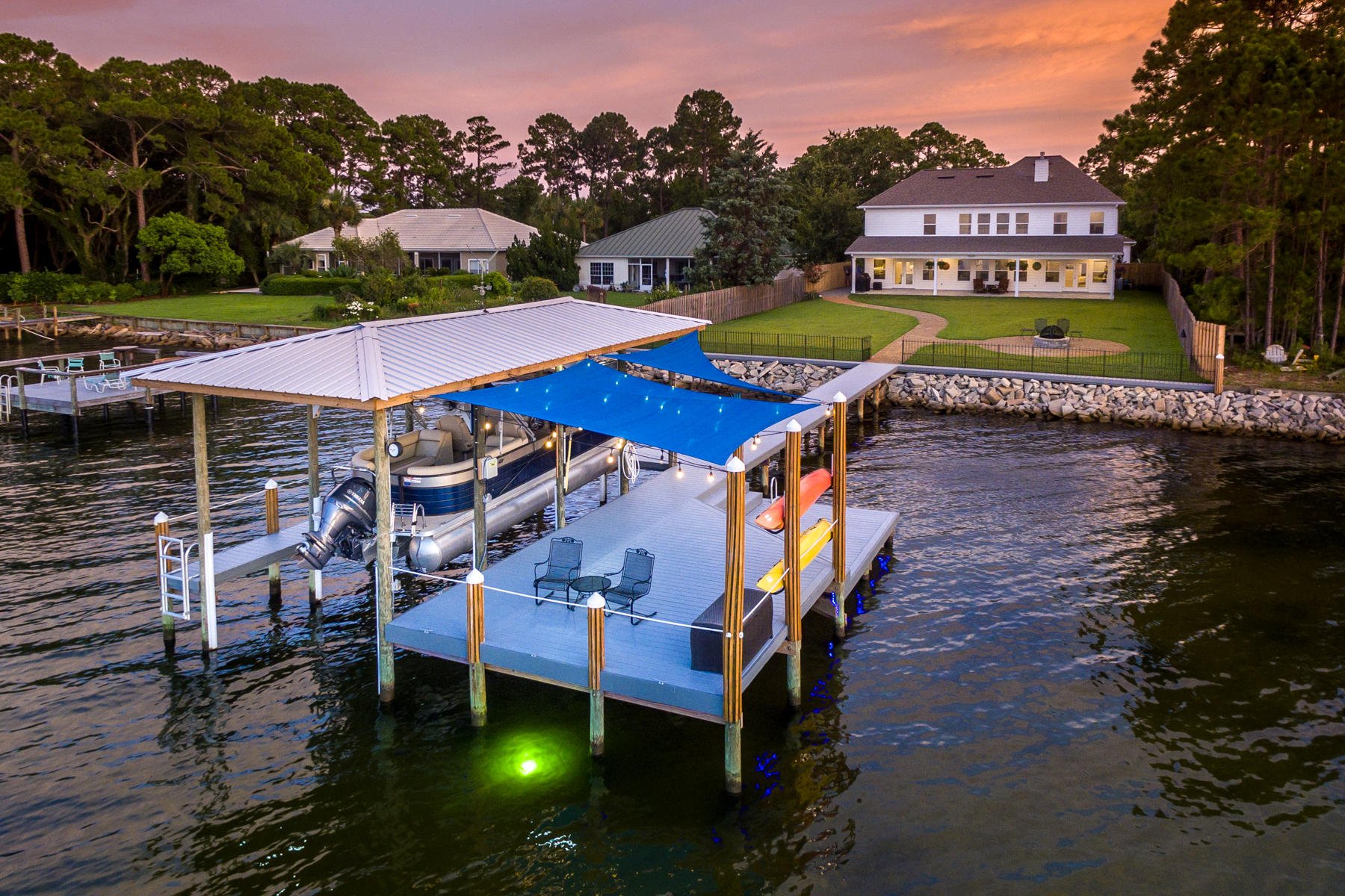 Why wait? Waterfront living at it's finest. NO HOA. This beautifully designed home has a coveted open floor plan. Choctawwatchee Bay is right out your backdoor. Plenty of room to add a large pool if you wish. Lots of natural light. Built with the latest hurricane standards. Home has exquisite finishes with granite, Electrolux stainless, gourmet kitchen, separate formal dining, custom tiled backsplash, Craftsman trim work and lighting, two Rinnai tankless gas hot water heaters, gas fireplace and Generac Backup Generator. Dog Friendly Lot. Unobstructed views.