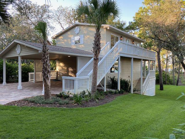 Prime Joe's Bayou Deep Waterfront Living!This rare over 1/2 acre homesite offers true deep-water access (8' depth) and a place for all your water toys--perfect for boating enthusiasts! The property features a NEW 60' dock and NEW seawall, with space to accommodate up to a 60-foot boat. Elevated at 18 feet above sea level, this lot is a true gem.The home offers 2160 SF of heated and cooled living space in a 3 level layout including a terrace level with a bedroom, full bathroom, and living area, and walkout access to the back porch and large flat backyard. Inside, you'll find a complete renovation with new kitchen countertops, new appliances, and Cali Bamboo vinyl plank floors throughout. Upstairs, the primary suite boasts sweeping water views, along with two additional bedrooms and another living space overlooking the bayou. A new roof was added in 2013. Best of all, there's no HOA!
Don't miss this rare opportunity for deep-water living in Joe's Bayou. Whole house new plumbing and new electrical in 2020. Owner is a licensed Florida Realtor.