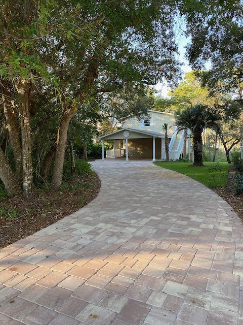 Prime Joe's Bayou Deep Waterfront Living!This rare over 1/2 acre homesite offers true deep-water access (8' depth) and a place for all your water toys--perfect for boating enthusiasts! The property features a NEW 60' dock and NEW seawall, with space to accommodate up to a 60-foot boat. Elevated at 18 feet above sea level, this lot is a true gem.The home offers 2160 SF of heated and cooled living space in a 3 level layout including a terrace level with a bedroom, full bathroom, and living area, and walkout access to the back porch and large flat backyard. Inside, you'll find a complete renovation with new kitchen countertops, new appliances, and Cali Bamboo vinyl plank floors throughout. Upstairs, the primary suite boasts sweeping water views, along with two additional bedrooms and another living space overlooking the bayou. A new roof was added in 2013. Best of all, there's no HOA!
Don't miss this rare opportunity for deep-water living in Joe's Bayou. Whole house new plumbing and new electrical in 2020. Owner is a licensed Florida Realtor.