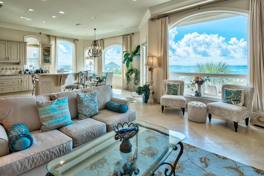 Impressive 4-Story Mediterranean-Inspired Beach Home with Plunge Pool, Private Beach Access, and In-Home Elevator in Gated Dunes of Destin. This vacation rental exceeded $180K in 2019. With updates, it's projected to top $250K in annual income! At the home's entry, a wrought iron gate leads to a private courtyard with private plunge pool. Tall palm trees and stucco wall, lining one side of the pool, provide privacy. Inside, an array of oversized arched windows and balconies carefully highlight the incredible views for a staggering, jaw-dropping sensory experience. Mediterranean architectural elements like sweeping arches, a tile roof,
