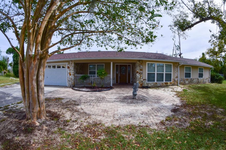 Fantastic 3BR/2BA home on nearly an acre in Parker! The roof is 2.5 years old, AC new in 2020, and the water heater was replaced in 2017. Features include hardwood floors, cathedral beamed ceiling, fireplace, a huge walk-in closet off the master bath, and a very roomy Florida room. The kitchen boasts stainless steel appliances, granite countertops and custom cabinets. The bonus room in the front of the home would make a great home office/music room or even as a 4th bedroom if needed. There is a two car garage and a circular driveway so parking will never be an issue. The backyard is spacious and there is room for a pool, workshop, etc.... You're less than 5 minutes from Tyndall AFB, schools, shopping, etc... All info is approx and must be verified by Buyers if important.