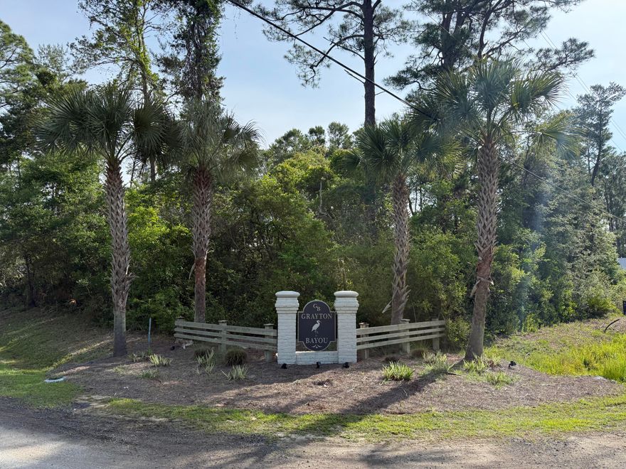 This Point Washington residential lot is locatated in the sought-after Grayton Bayou! Discover the perfect opportunity to build the home of your dreams in this highly desirable neighborhood. This exceptional lot offers access to a charming community with a resort-style pool just minutes from everything 30A has to offer. There is a private boat launch for easy days on the water and a public bay front dock with a kayak & paddle board launch, fish cleaning station and picnic table to enjoy waterfront lunch or board games with the family. Grayton Bayou is a very peaceful and walkable neighborhood! Enjoy a stroll or bike-ride through the state forest or head down to the beach. This is the perfect lot to build your full-time residence or coastal retreat!
