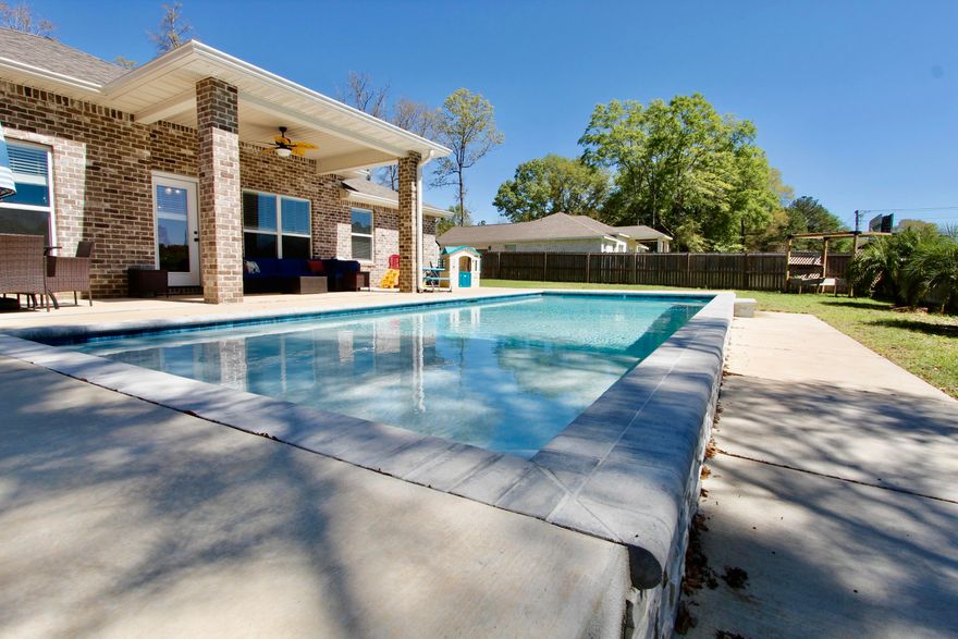 This home features 4 bedrooms and 2 full baths. This home has been taken care of and has had 1 owner! All brick home features a private pool and the lot is level. It has an open concept split bedroom, side entry garage and beautiful finishes! The kitchen has custom white shaker cabinetry and quartz tops throughout. Even the laundry features built in cabinetry! The yard is fenced in with irrigation system. Tray ceiling with crown molding  in the master bedroom. Lake Arthur Estates which offers residents a playground, basketball court, and beautiful lake to enjoy!