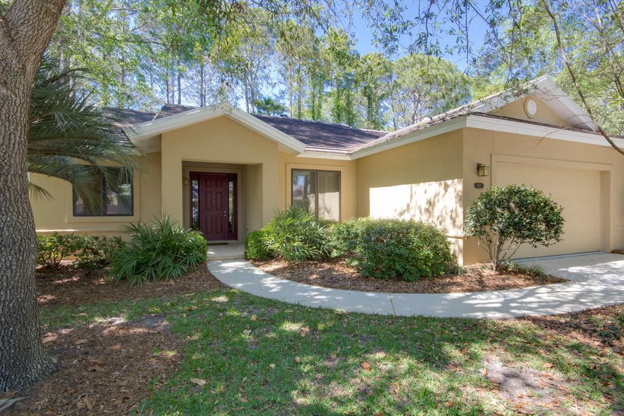 Gorgeous, remodeled home with a large 2 car garage! Offered fully furnished with all new bedding and living room furniture, new Samsung appliances, two refrigerators, and a fully stocked kitchen. This home sits on a very private and lushly landscaped lot, overlooking a nature preserve with a stream that runs through the back edge of the lot and a stone waterfall feature. The tranquil back yard can be enjoyed from the beautiful and large screened lanai or from the red wood deck. This home has many custom features to include sophisticated smart lighting system that controls the interior and landscape lighting, custom built bunk beds, built in sound system, heavy crown molding, arched doorways, plantation shutters porcelain tile floors, and natural cork flooring in the kitchen.