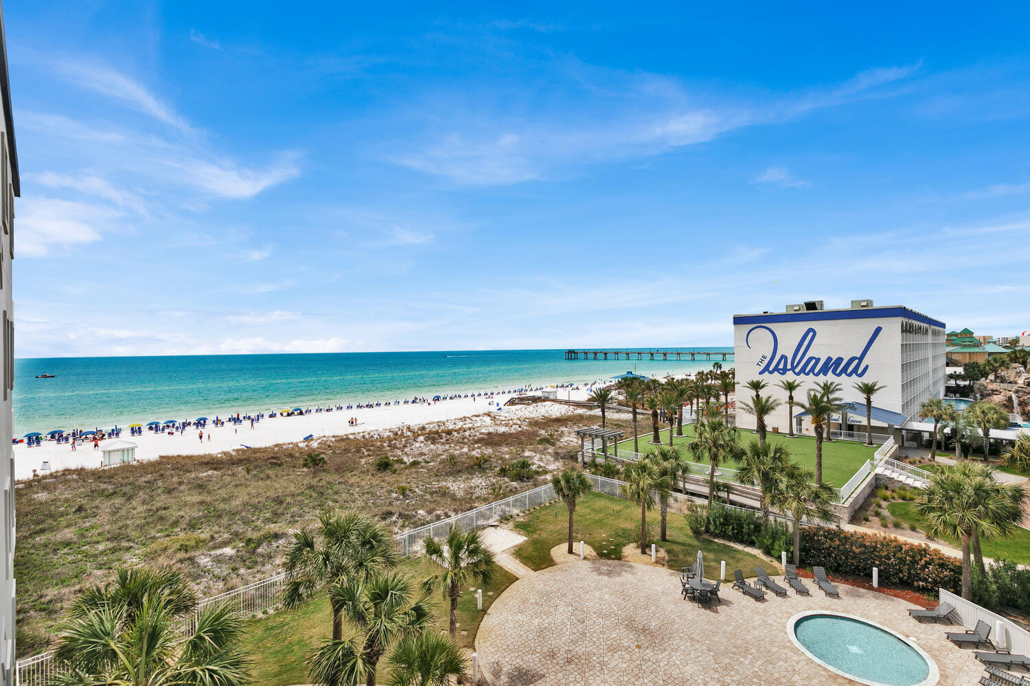 Welcome to one of the most beautiful condos with amazing views of the gulf, overlooking the gulf side pool areas. The balcony is open on both ends allowing expansive views where most balconies have walls on one or both sides. The condo is professionally decorated to perfection with a coastal vibe throughout. The unit is conveniently located on the same floor as the pedestrian bridge that takes you across Hwy 98 to all that Bayside has to offer. Also has COVERED PARKING garage with loads of space. The kitchen has gorgeous textured countertops that capture the look and feel of sand, sea, and surf... breakfast bar with seating & stainless steel appliances. Primary bedroom has tray ceiling with fan, king size bed, tile flooring throughout, plantation shutters, and private full bathroom. The bunk room has a TV and easy access to the shared bathroom. Washer/Dryer in unit. Unit accomodates 6 people with the sleeper sofa.
Destin West Beach & Bay Resort offers endless amounts of fun for owners and guests, making it one of the most sought after place to stay on Okaloosa Island. All guests at Destin West enjoy both bayside and Gulfside amenities easily via pedestrian bridge over Hwy 98... Gulfside amenities include a 5,000 sq ft lagoon style swimming pool, oversized hot tub, and kiddie pool. On rainy days, enjoy the covered pool. Charcoal grills and picnic tables also available for use.
Bayside amenities include a 700ft lazy river with tubes, waterfall pool, two hot tubs, and a Zero Entry Pool. This portion of the complex also features a beautiful walking path along the Choctowhatchee Bay, and a marina/fishing pier. Also available onsite is a fitness center, and a covered kids play zone - perfect for rainy days!
