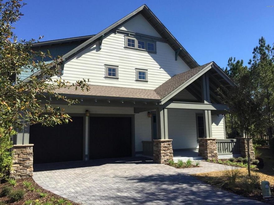 $5000 Selling Agent Bonus. Must close before 12-31-16Tucked away on a quiet street in the gated community of Wild Heron, this exceptional craftsman style home can be yours! Built by the award winning David Weekley Homes, this energy efficient 4 bedroom, 3.5 bathroom home is thoughtfully designed with all of the upgrades you deserve. The first story features open living concept, a guest room/study and a gourmet kitchen complete with granite countertops, soft close drawers, upgraded GE stainless appliance package and 42 upper cabinets. The second floor includes an incredible master suite with room for a sitting area and two additional guest rooms. Enjoy outdoor living with two spacious covered porches and a private back yard.