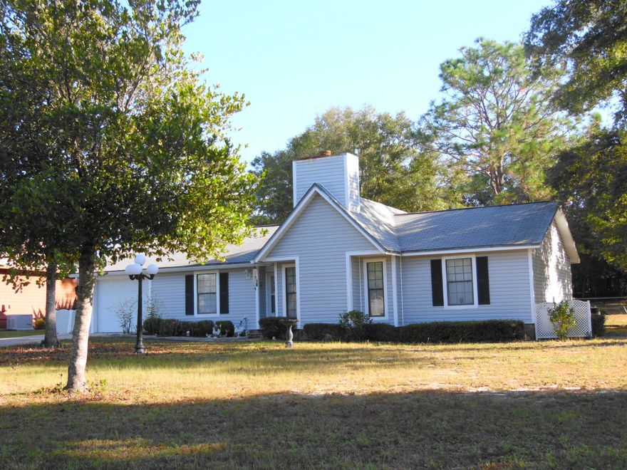 Location, Location! This is a great location in the center of DeFuniak Springs, near schools and shopping, this 3 bedroom 2 bath home with single car garage, chain link backyard fence, and storage building has all been extremely well cared for. Home has vinyl siding and shingle roof. Interior has split bedrooms with stone face gas log fireplace in the great room. Plenty of storage and extra space in the garage for extras. Inside laundry and panty. Super space saver kitchen with stove, refrigerator and dishwasher. Home had all new plumbing installed in 2000, it is wrapped and insulated. PLUS, with owner's approval...OWNER FINANCING! Yes, call today, easy to show!