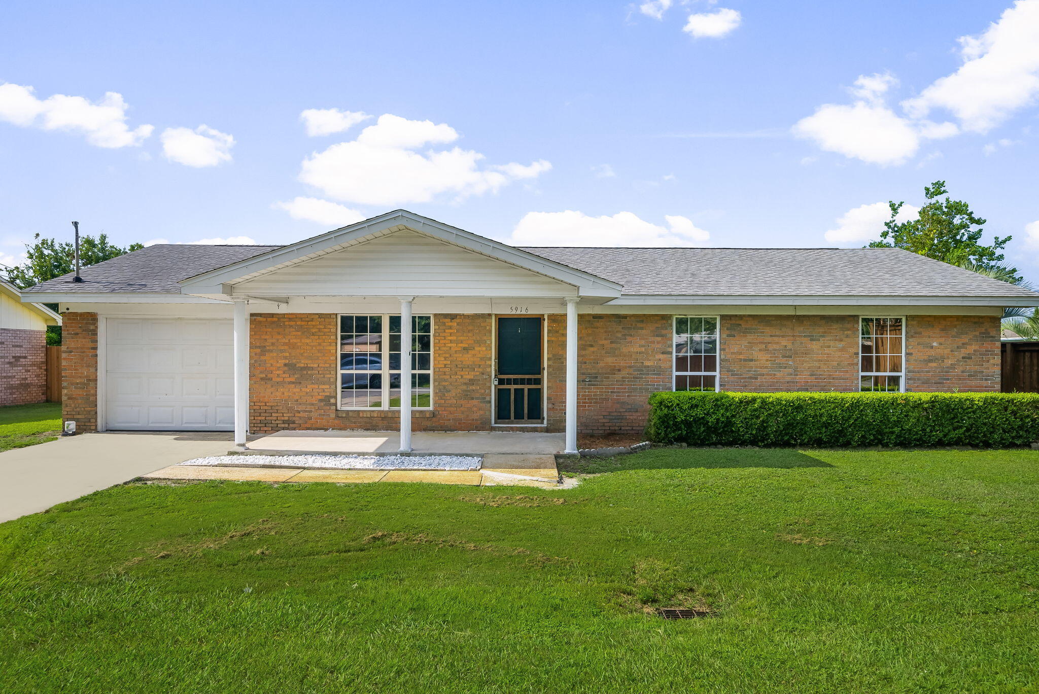 Welcome to 5916 Lake Drive in Panama City, a solid brick home with great potential just 15 minutes from Tyndall Air Force Base. This 3 bed, 2 bath home sits on a fenced .20 acre lot with a 2019 roof. Inside, the open layout offers natural light and bold cabinetry, ready for your finishing touches. The interior needs some work, giving you the chance to design it your way. Outside, enjoy a vinyl-fenced backyard perfect for pets or gatherings, a covered patio for relaxing, a workshop for hobbies, and a welcoming front porch. With a one-car garage and a convenient location this property is a great opportunity!