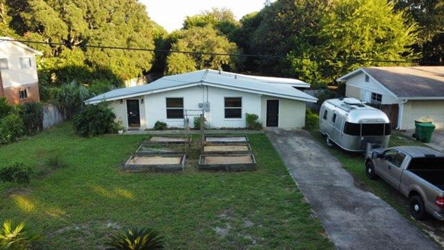 Here is the homestead you've been searching for. Metal Roof, Stainless Appliances, HVAC replaced Dec 2018. On one side of the property there is a breezeway which is perfect for tools, toys, etc  The backside offers a covered patio overlooking the backyard. At the rear of the property there is a nice size shed and double gate access to the back alleyway perfect for utility trailers and/or a RV. The seller already has the raised beds out front and plenty of room in the huge fenced in backyard to plant whatever you desire. This neighborhood is where you want to be! Located only 6 blocks from Garniers Beach Waterfront Park that has 240 feet of Bayfront beach for swimming / boat ramp, playground etc.