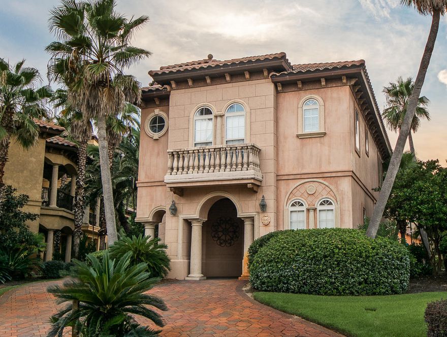 Saint Tropez is a gated community across the street from the beach with DEEDED beach access! A Mediterranean, Tuscan style community featuring cobblestone streets, a tropical lagoon style pool with a heated Jacuzzi and 500 Palm trees! This exclusive 4-bedroom, 3.5 bath home overlooks the lagoon style pool, has faux painted exterior, tile roof and a large balcony with pecky cypress ceiling. The well-appointed kitchen is equipped with upscale stainless steel appliances, including a sub-Zero refrigerator, Dacor gas cooktop, granite counterops and breakfast bar. The Living room is all glass on the west side with sliding glass pocket doors that open the entire corner of the living room to bring the lush tropical paradise inside. The first floor features a king bedroom with ensuite bath, a 2nd