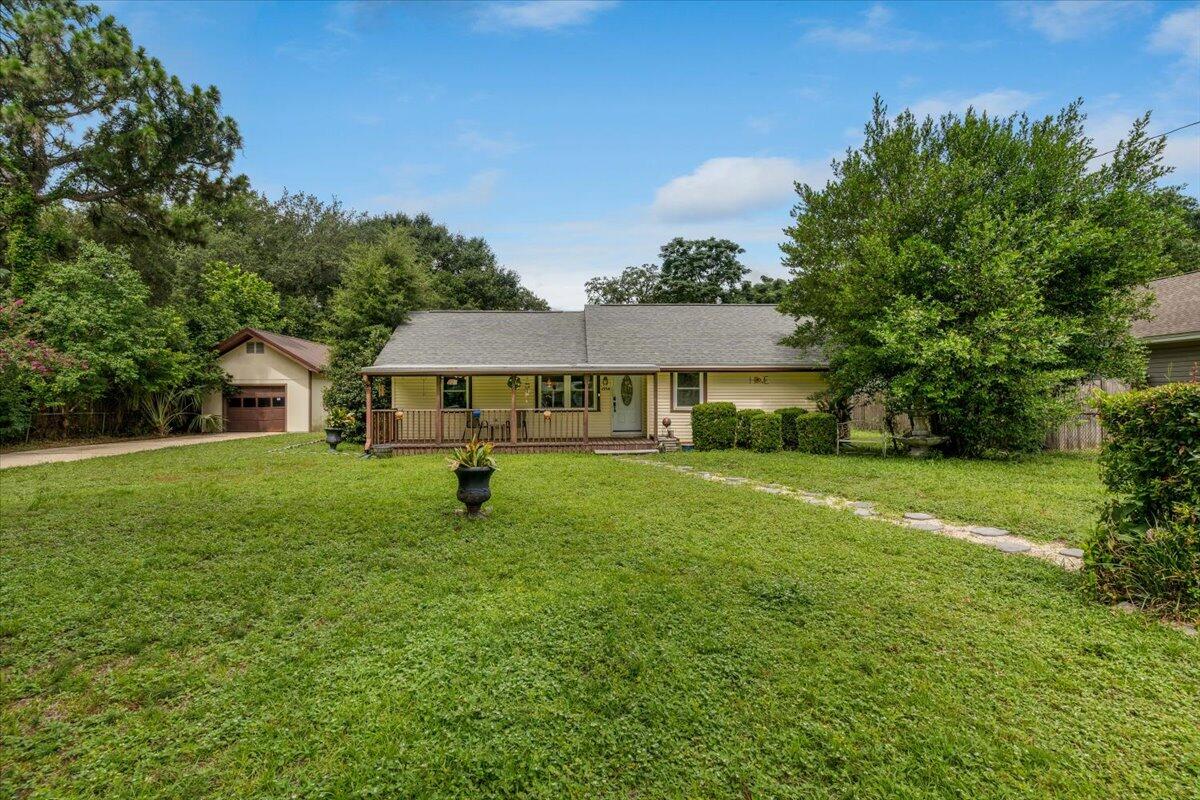 Charming 2BR home in the heart of Niceville with no HOA and a spacious, fully fenced yard--perfect for entertaining, pets, or adding a pool. Inside, you'll find gleaming hardwood floors, an open layout, and an updated kitchen featuring granite counters, stainless steel appliances, and bar seating. Enjoy morning coffee on the covered front porch or unwind on the private back patio. A detached garage offers extra storage, a workshop, or space for your outdoor toys. Just minutes from the Emerald Coast's sugar-white beaches, the Bay, boat launches, dining, shopping, and Eglin AFB. This home has it all--space, location, and freedom to live your way. Schedule your showing today!