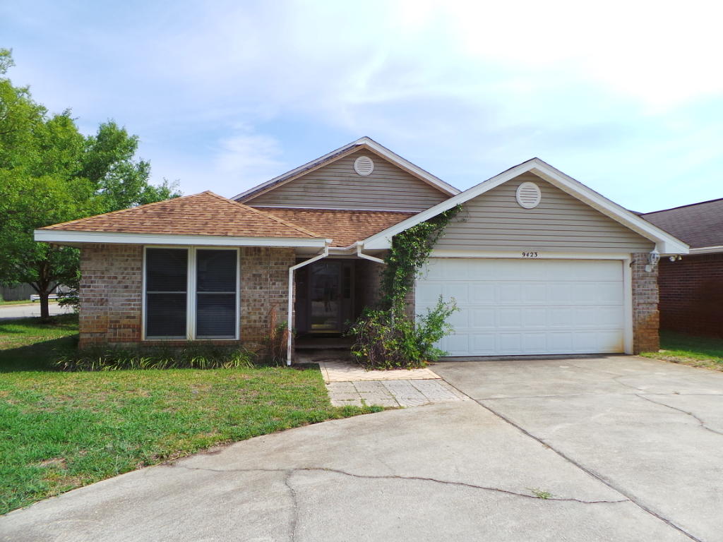 *Open and Bright with TONS of Natural Light*Beautiful brick 3 bedroom, 2 bath home located in gorgeous Navarre. 2 car garage with wide driveway, offering plenty of parking. Ceramic tiling and hardwood flooring throughout. Eat in kitchen. Dark wood cabinets with kitchen island. Microwave and dishwasher. Open living dining area with cathedral ceilings. Ceiling fans Master bath with his/her vanity, and jetted tub. Screened in back porch with hot tub. Privacy fenced in back yard.