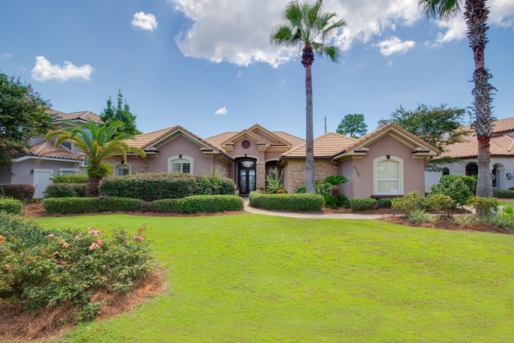 This beautiful lakefront home is on one of the larger lots in Destiny East. Fully remodeled with lots of beachy Blue Pine accents, the 1 story home offers four bedrooms with an open floorplan and excellent lake views. Tile flooring can be found in the principal living areas, with wood floors in the bedrooms. The family room off the kitchen features a gas fireplace and the living room has a built in rock electric fireplace. Prepare meals in a chef's kitchen with quartz countertops, stainless steel appliances, and a show stopping cobalt blue professional grade Kucht stove. With an ideal layout for entertaining, there is a breakfast nook in the kitchen, as well as a formal dining area in the living room. Double doors lead to a screened-in pool & large patio, and a spacious fenced in backyard.