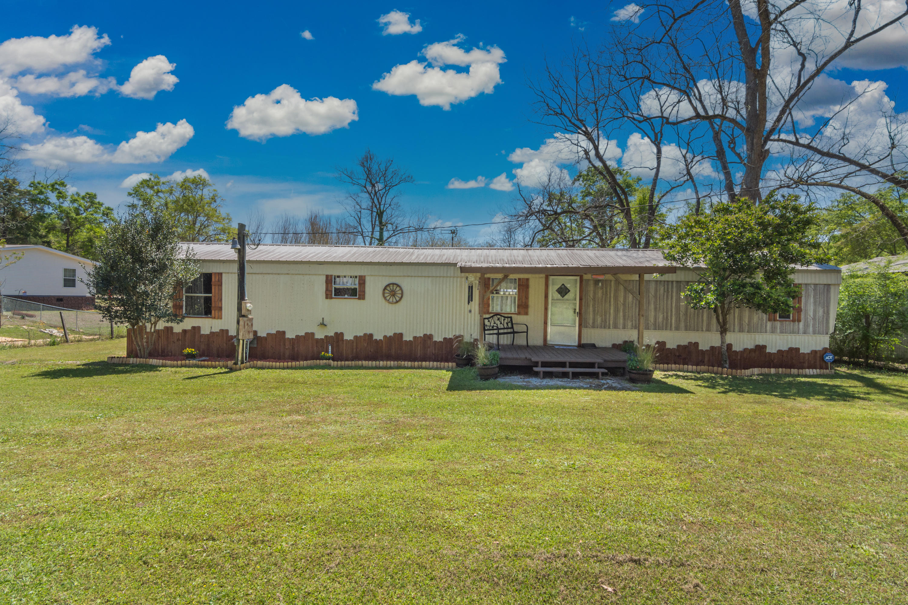 Move In Ready 3 bed 2 bath fully renovated home waiting for you to call it yours. As you walk in you will right away notice the attention to detail with the Farm House flare! There is a large den area in the back for additional space for moving watching and hanging out. Home boasts a brand new HVAC, new water heater, new plumbing, fully renovated and a metal roof. There are two outbuildings with electric and water for additional storage and tinkering in the workshop. Property sits on a beautiful half acre lined with crepe myrtles, palms, outdoor lighting and peacefulness. Located in the center of town providing easy access to schools, shopping centers, and within an hour drive of the beautiful Destin beaches.