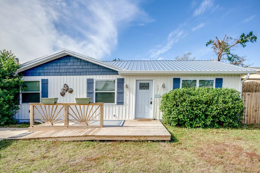 Perfect beach home has been completely remodeled, only a few minutes walk to beach! New metal roof, vinyl siding, windows, and all exterior doors including beautiful French doors opening onto the newly added rear deck. New front porch with step or ramp for easy access. This remodel includes all new sheetrock on all interior walls and has been freshly painted throughout. Plumbing upgraded throughout, including a newly installed tile shower in bath master bath, and tankless gas water heater. The baths have new tile floors, vanities with cultured marble tops, custom-made vanity mirrors, lighting, and fixtures. Electrical upgrading throughout and includes smoke/CO2 alarms, LED lighting and ceiling fans in all 3 bedrooms and living room fan w/ remote. New appliances include refrigerator