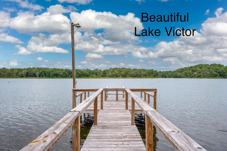 Discover lakeside living at its best on beautiful Lake Victor, a state-maintained fishing lake! This 2002 doublewide offers 3 bedrooms and 2 full baths, perfectly set up for both full-time living or a weekend getaway. Fresh updates include new interior paint, LED lighting throughout, new carpet in bedrooms, and an updated master bath with new vanity, plumbing, and flooring.Enjoy the outdoors with a screened back porch overlooking the water, an above-ground pool for summer fun, and your own 2-slip boathouse with pier and fish-cleaning station--ideal for anglers and lake lovers alike.A rare opportunity to own a move-in ready lake property with modern updates and all the amenities for relaxation and recreation.