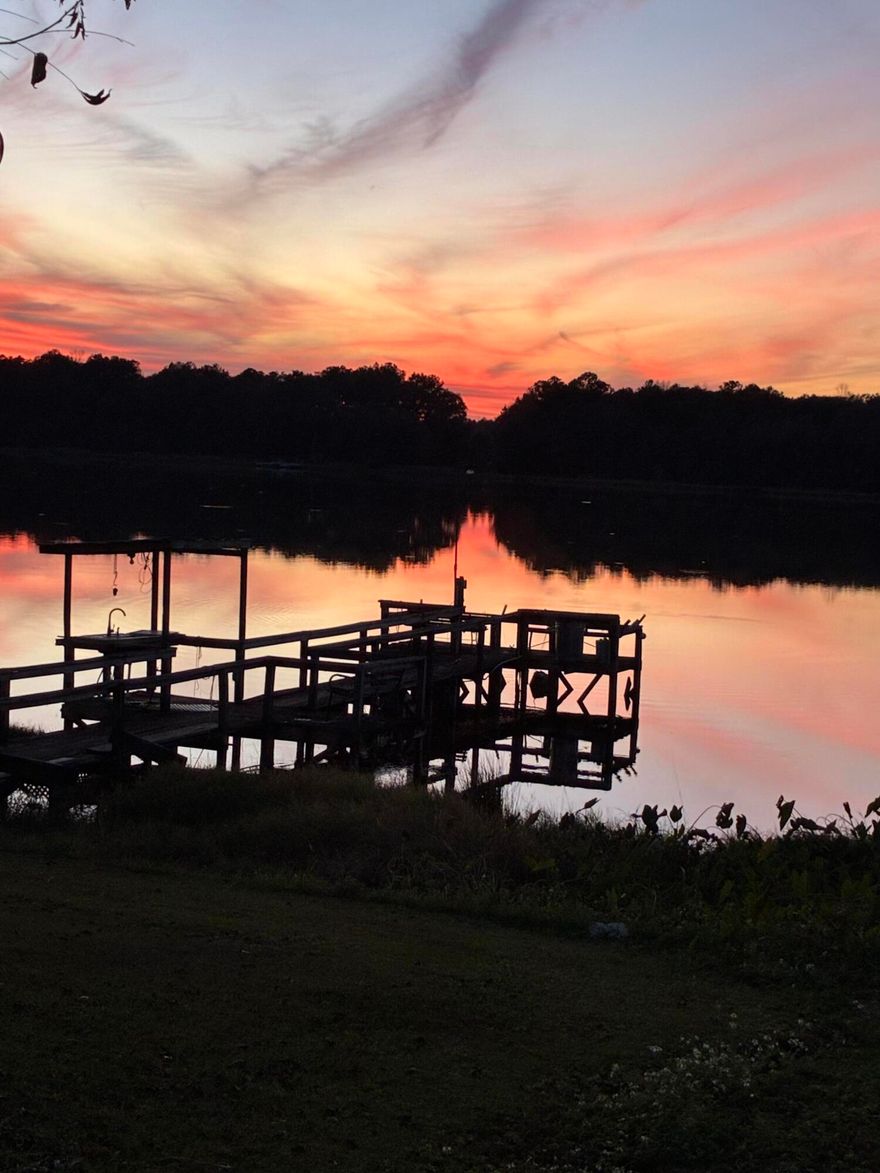 Discover lakeside living at its best on beautiful Lake Victor, a state-maintained fishing lake! This 2002 doublewide offers 3 bedrooms and 2 full baths, perfectly set up for both full-time living or a weekend getaway. Fresh updates include new interior paint, LED lighting throughout, new carpet in bedrooms, and an updated master bath with new vanity, plumbing, and flooring.Enjoy the outdoors with a screened back porch overlooking the water, an above-ground pool for summer fun, and your own 2-slip boathouse with pier and fish-cleaning station--ideal for anglers and lake lovers alike.A rare opportunity to own a move-in ready lake property with modern updates and all the amenities for relaxation and recreation.