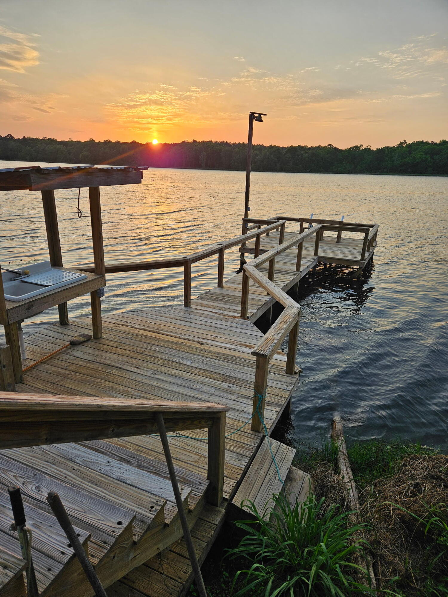 Discover lakeside living at its best on beautiful Lake Victor, a state-maintained fishing lake! This 2002 doublewide offers 3 bedrooms and 2 full baths, perfectly set up for both full-time living or a weekend getaway. Fresh updates include new interior paint, LED lighting throughout, new carpet in bedrooms, and an updated master bath with new vanity, plumbing, and flooring.Enjoy the outdoors with a screened back porch overlooking the water, an above-ground pool for summer fun, and your own 2-slip boathouse with pier and fish-cleaning station--ideal for anglers and lake lovers alike.A rare opportunity to own a move-in ready lake property with modern updates and all the amenities for relaxation and recreation.
