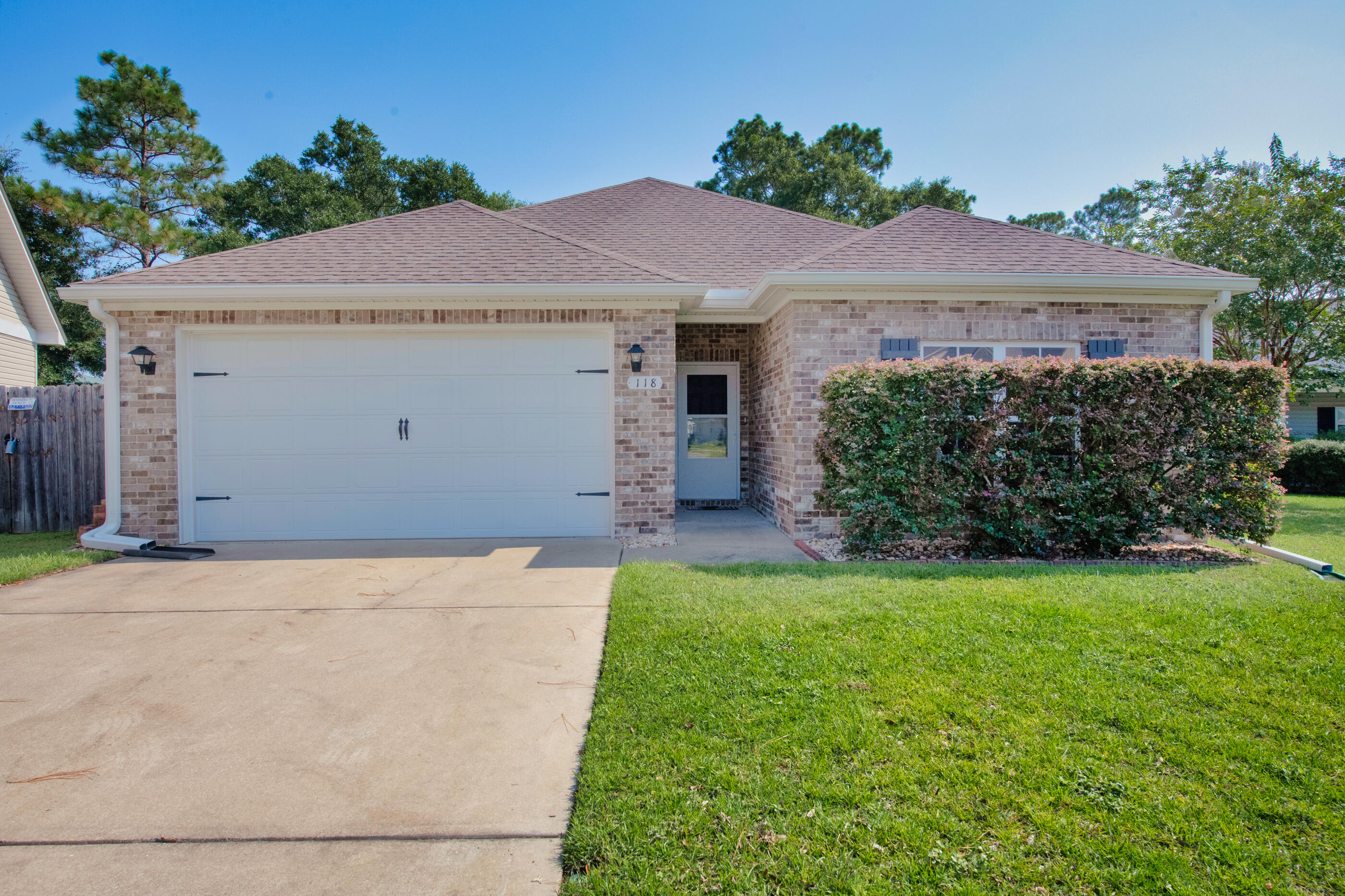 Three words-- Randy Wise Construction-- and this brick/vinyl beauty is listed for less than $300,000! Randy Wise Construction for that price??? Yep!Welcome to 118 Creve Core Drive! This 3 BR/2 Bath upgraded floorplan is nestled on a cul-de-sac lot, steps away from the hospital, and boasts an array of signature features this award-winning builder is known for. Step inside to elevated ceilings with CROWN MOLDING and UPGRADED TRIM; as well as neutral paint and large ceramic tile flooring.The Great Room is grand in scale, and ALL WINDOWS FEATURE UV/SOLAR TINT; blocking the majority of harmful ultraviolet rays without sacrificing precious light.    The kitchen features rich mahogany cabinetry with CUSTOM BUILT-INS, SOFT CLOSE DRAWERS and high end fixtures. There's also a WALK-IN PANTRY, GRANITE ISLAND, black appliance suite and deluxe-sized dining area (with room for coffee bar addition).  

All bedrooms are large with plush carpeting, to include the master suite.

The master bath boasts premium granite vanity with his/her sinks, as well as soaker tub/shower and spacious L-shaped master closet (pictured in photo lineup).

BONUS: WOOD BLINDS throughout the entire home!

Step outside to a fully PRIVACY-FENCED BACKYARD, bordered by trees and a medical facility! No backyard neighbors here! Instead, you have a "medical neighbor" with their own 24-hour security! You also have HARD-WIRED MOTION SENSOR SECURITY LIGHTING that will convey with purchase.

Other notable mentions: worry-free city water/city sewer, PEX PLUMBING, and a sprinkler system for your low-maintenance yard. With a modest .19 of an acre.. you can enjoy weekends at the beach instead of laboring in the yard. 

This home is centrally located and offers a quick commute to the base. Make an offer today! 