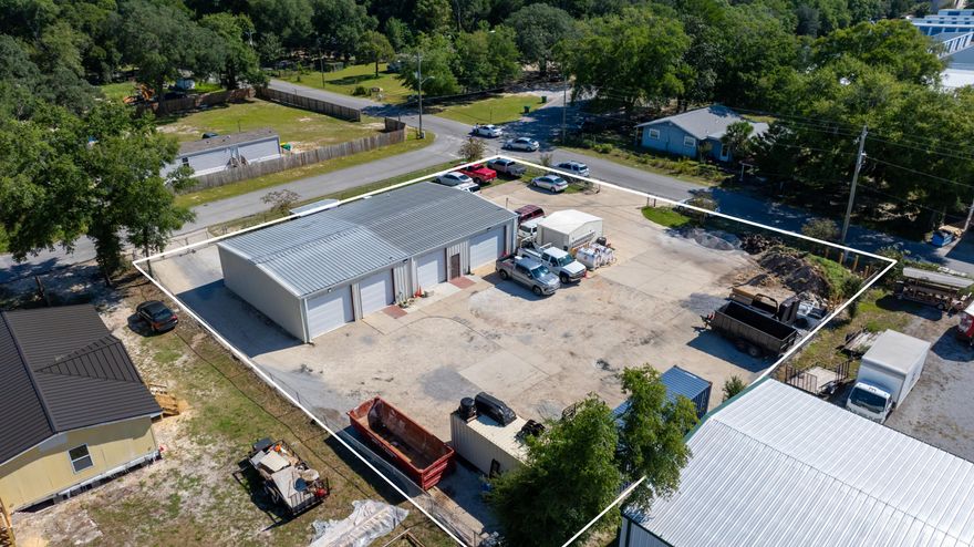 **Warehouse** in the Heart of FWB!! Excellent opportunity to lease a versatile warehouse in the heart of Fort Walton Beach! The 3400 sq.ft. includes 2,800 sq.ft. of open warehouse space, a 425 sq.ft. mezzanine and 1216 storage unit. Features a 120 sq.ft. A/C office with attached bathroom, plus an A/C kitchen/breakroom with full bath, shower, and washer/dryer. Five roll-up doors provide easy access for equipment or vehicles. The large, fully fenced lot offers ample parking and outdoor storage options--ideal for contractors, distributors, or small business operations