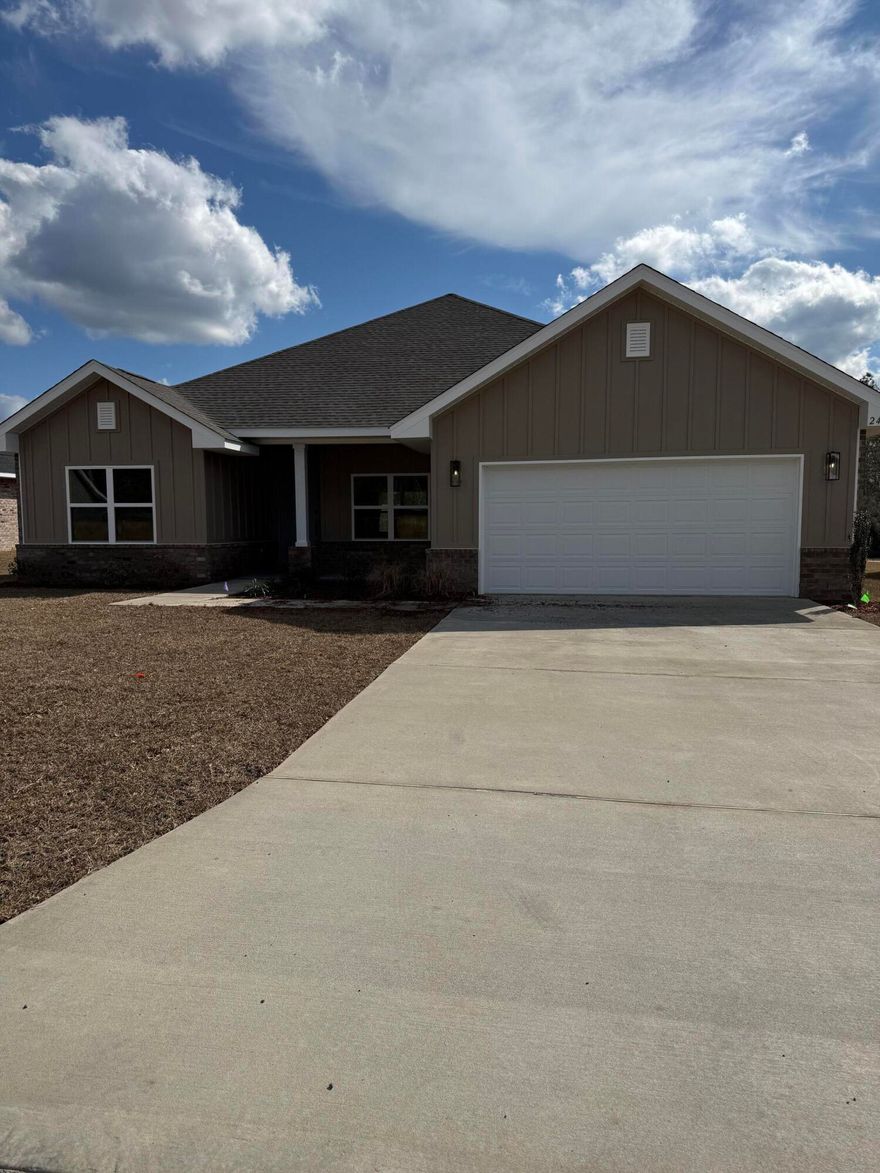 Welcome to Brookwood, our newest neighborhood tucked away in North Crestview-close to Highway 85 and town. This 2,005 sq ft home features a split floorplan with 4 bedrooms and 3 full bathrooms, offering both space and privacy. Built with 3 side brick, Hardie front, and brick skirt, the home showcases a tall roof pitch, covered front and back porches, and a 9' plate creating tall interior ceilings for an open, updated feel. Inside, enjoy granite or quartz countertops throughout, upgraded LVP flooring with carpet only in the bedrooms, modern finishes with black fixtures and hardware. Additional features include a 1/2 acre lot, automatic sprinkler system, fully finished 2 car garage and a 10-year bonded builders' warranty! Brookwood combines style, quality and convenience a charming location
