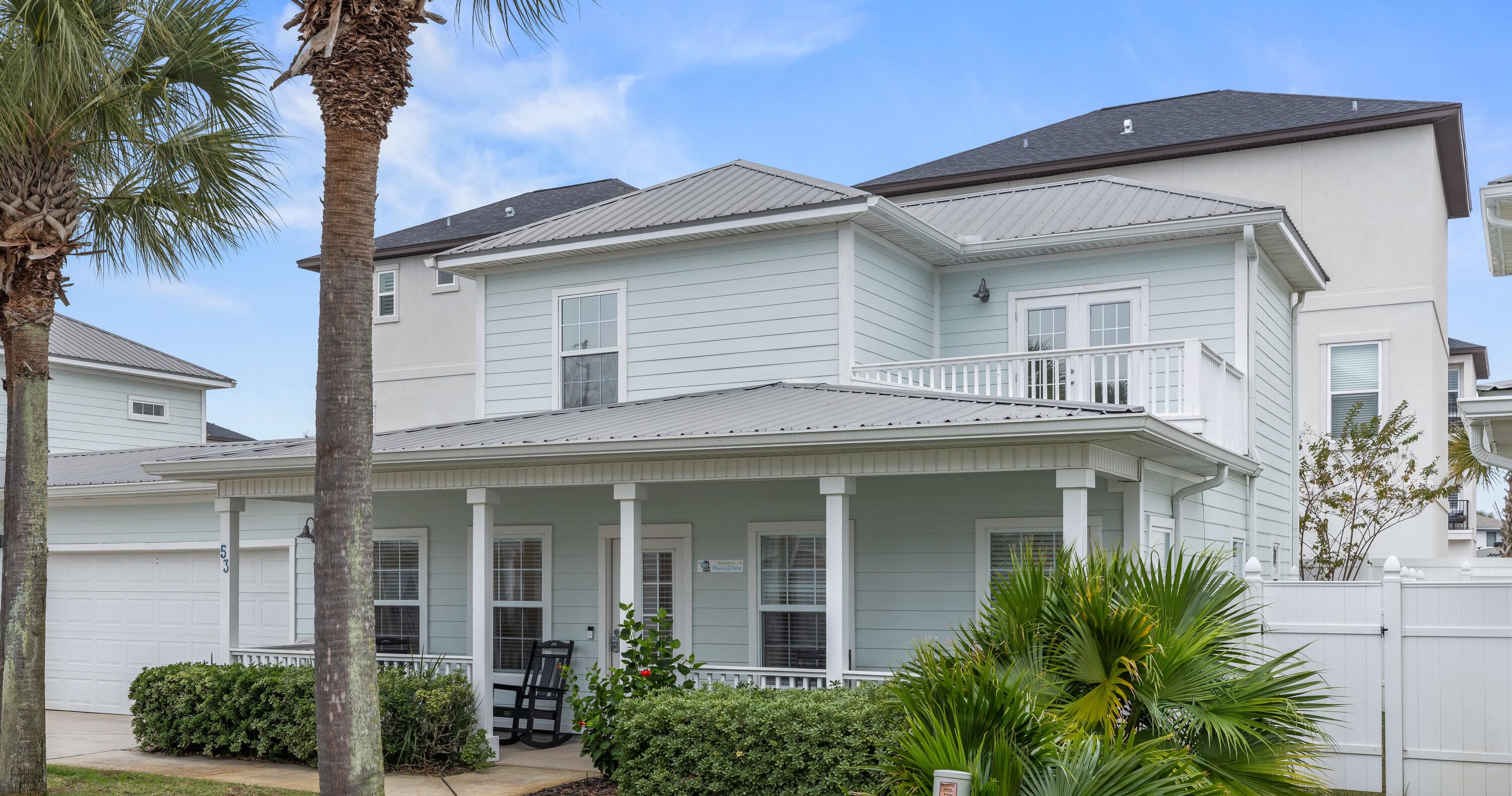 Two story beach home w/balcony, covered front porch, rear patio, attached 2-car garage in quaint, private, 10 home cove community! 1 1/2 blocks to beach & bike/jogging path. Public beach access at Pompano Joe's, Steps away from the community pool. Outside dining in rear with enclosed shower stall. Nearby pool. Open floorplan with large kitchen/dining living space downstairs with access to half bath. Primary suite is down stairs with large bath. roomy separate shower, oversized garden tub, ample closet, double vanity & lots of windows! Second and third bedrooms are upstairs with access to a large second story balcony.