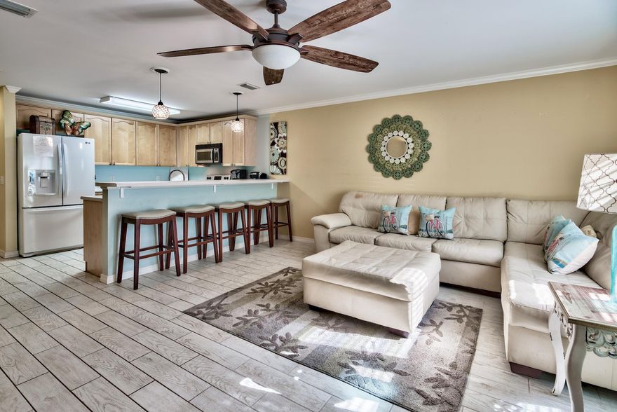 INCREDIBLE INVESTMENT OR VACATION HOME THAT CAN PAY FOR ITSELF! WOW!! 10% - 17% RETURN ON INVESTMENT BASED ON ACTUAL 2016 and 2017 RENTAL INCOME! Bring your flip flops & toothbrush & live here tomorrow. Low $211 monthly HOA dues and two parking spots. Depending upon amount of Owner's personal use, this 3 bedroom, 3 full bath, all w/en suite access, fully furnished & equipped town home, located DIRECTLY ACROSS THE STREET from the beach, has brought in $32,400 to $37,500 annual rental income. Location couldn't be better. To enjoy the sugar white sandy beach & crystal blue waters of the Gulf, the gated, deeded beach access is just across the street, with added safety of traffic stop sign,This town home, with no units above you, which features an open floor plan w/ tiled, wood look floors in the main living areas, Luxury Vinyl Plank flooring in the upstairs bedrooms, kitchen with new SS stove & microwave, large eating bar, laundry area & small back patio offers the beach life you've always dreamed of.  With the ability to sleep 10, enjoy a 400 SF master & two add'l nice size bedrooms, (You could sleep 11 or 12 if you added children in the Master).  Four year old storm rated windows provides peace of mind and lower insurance cost. Amenities include private, gated beach access, community splash pool/Jacuzzi & picnic area. Located directly on Scenic Hwy 98, this home is close to restaurants, shopping, golf & tennis; and Alvins Island will be completed by high season so anything you need will be close by!  Home is rental ready as all linens, housewares, decor, & furniture convey with sale.  Over $3300 in 2018 bookings in just the last week that can be conveyed to Buyer or moved to another rental company.  Buyer to verify all information important to them.  Best 3 BR/3 Bath deal on Scenic Gulf!  Act now on this fantastic opportunity.