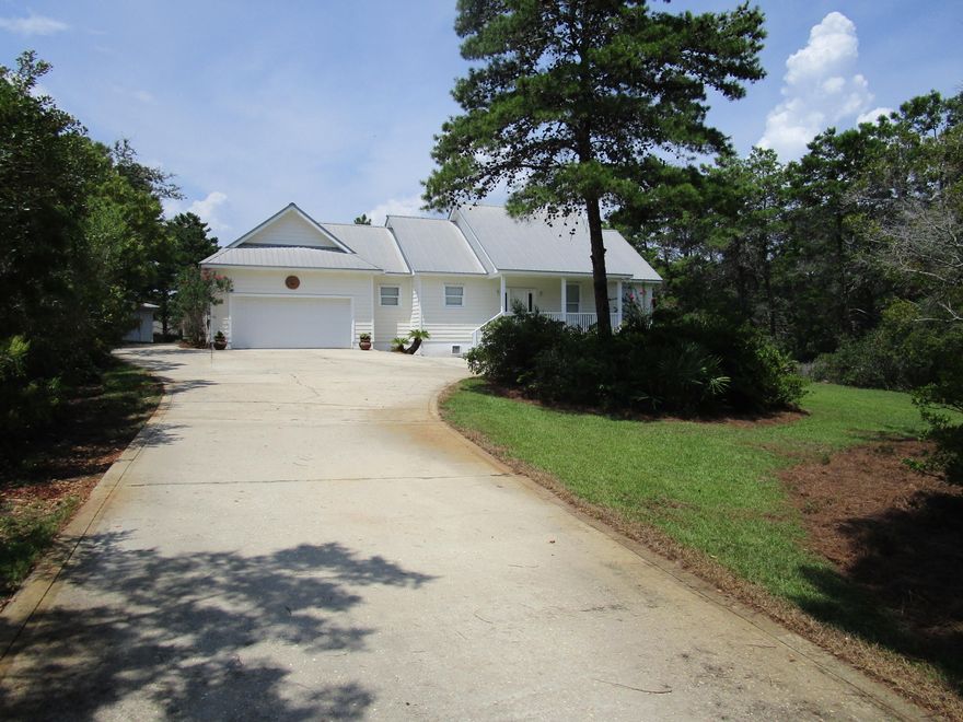 Lake front ranch near public beach access & golf course! Space and quality abound in this well-developed, family-oriented residence. Spacious great room has step-up ceiling to 11' in height. This comfortable living space is open to dining area with bay windows providing lake views across stupendous 10' x 30' screened back porch. Very convenient and functional kitchen with abundance of cabinets and a centrally located breakfast bar. Split bedroom design with master bedroom tastefully secluded on one wing and 2 additional bedrooms with a shared bath on opposite wing. The master bedroom emulates the great room with its own 11' step-up ceiling, and features a large walk-in closet. The master bath has a whirlpool tub, and separate shower/toilet room. There is a convenient 1/2 bath