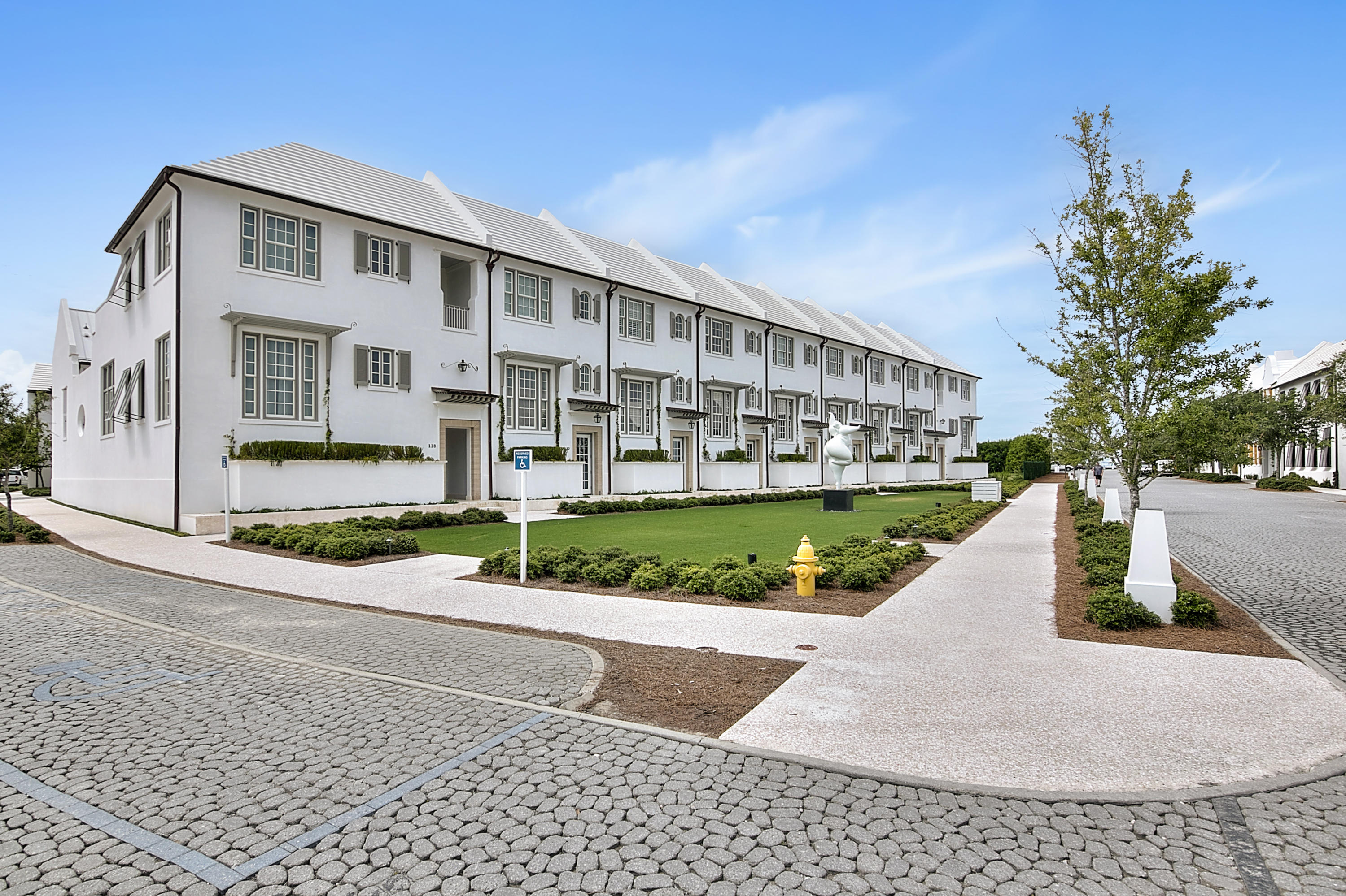 Located in Alys Beach, this lovely rowhome offers luxurious coastal living charm. Upon entering this light-filled home, you are greeted by beautiful interiors by Bohlert-Massey. Caliza Courts rowhomes are designed by the renowned Khoury-Vogt Architecture team and provide a desirable living option in close proximity to the sparkling Caliza Pool amenity. Fine architectural details and luxe furnishings are nestled throughout the home creating an elegant space that is both inviting and visually appealing. The expansive great room boasts reflective Venetian plastered walls, 16-foot ceilings as well as oversized French doors and windows offering a seamless flow out to the private courtyard, dipping pool and guest suite. The kitchen offers beautiful views of an expansive greenspace and offers top of the line Thermador appliances, pellet ice machine, cabinetry and Venetino marble countertops.
The second bedroom provides room for three with a private bathroom. The spacious master suite is bathed in natural light and offers a view of the courtyard. Perfect for unwinding after a day at the beach, the master bathroom comes equipped with double vanity stone vessel sinks, rain shower head, Dominican Shellstone floor to ceiling tile and a skylight. The Master Suite and the second bedroom each occupy their own half floor offering plentiful privacy. Additionally, this home is outfitted with Control 4 system allowing remote monitoring and set systems from a cell phone. TV and electronics are included in the listing price. Furnishings are included with a short list of exclusions.
The inviting courtyard is accentuated by a heated dipping pool, fountain, as well as Dominican Shellstone paving and easy to maintain landscaping. Across the court, you'll find a covered, open-air loggia fronting a private guest suite positioned above a one-car garage. The loggia offers an additional space for lounging, dining and quiet evenings at home. If desired, the detached guest suite with private bath and the main home can both be rented individually with the ability to lock and separate the two spaces. In addition to the garage, the homeowner has an additional assigned parking space in the parking court.