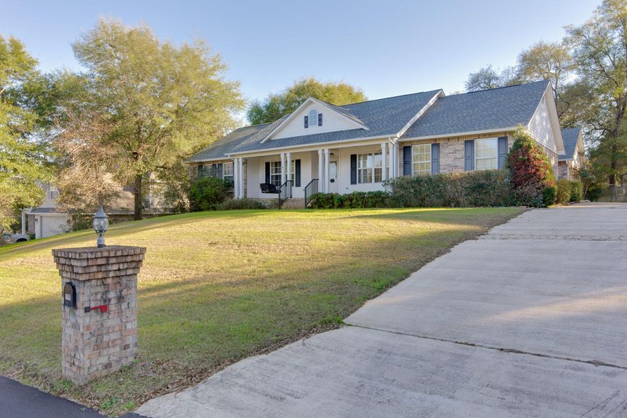 Charming Southern style home in South Crestview with a nice big front porch is ready for you to call it home. This 3/2 plus an office has a split floorpan and an oversized side entry garage. This open floorpan has lots of extra living space and tons of storage. The long driveway has plenty of room for a boat, RV, trailer or extra vehicles too. The interior living space has brand new wood floors and a nice newer kitchen with a hop up bar. Great for entertaining!Roof is brand new(2016) and the HVAC system is from (2011). Nice private backyard with wooded lot behind. Don't wait! Wont last long!