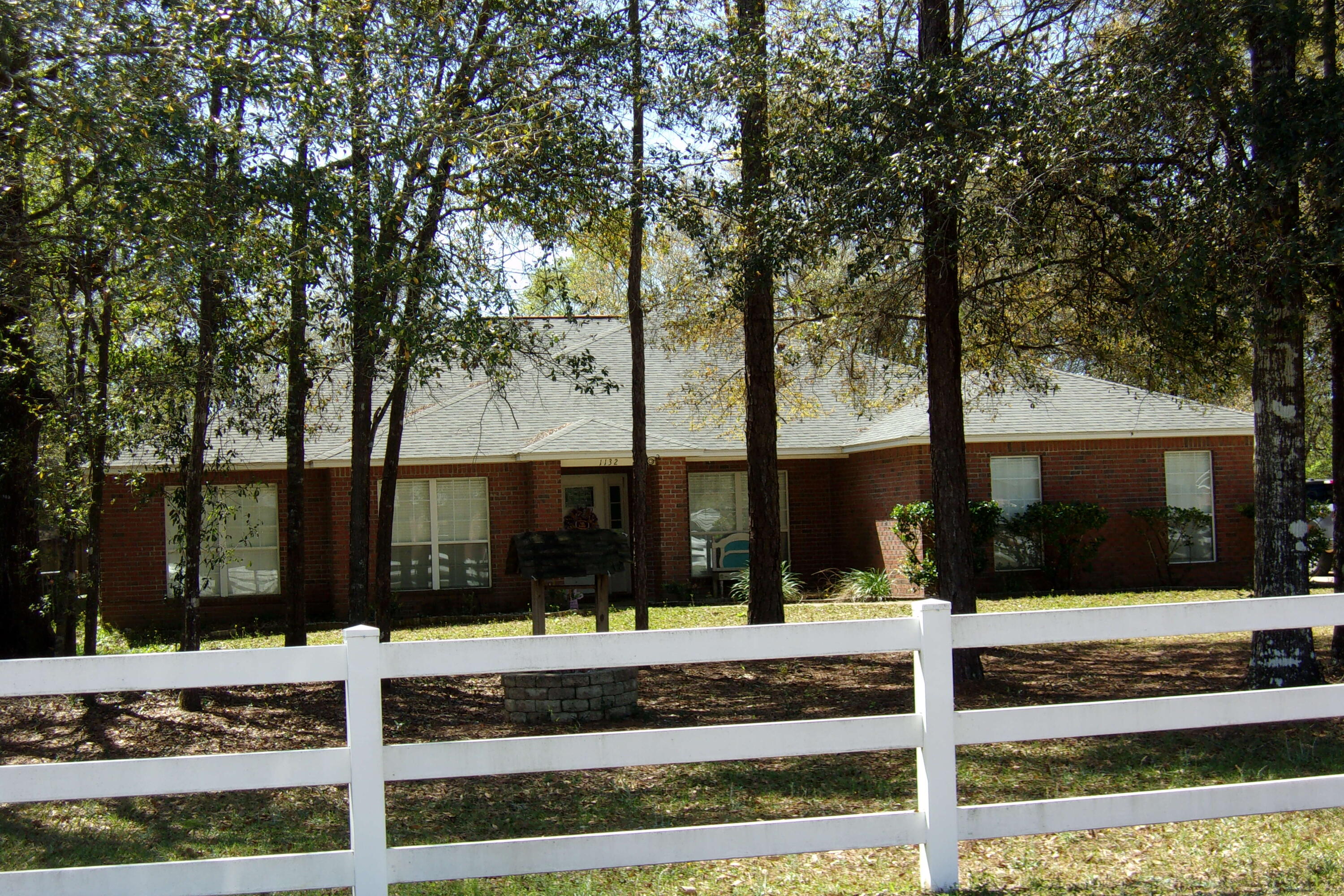 4 Bedroom, 2 Bath on one acre in Baker~ There is vinyl plank flooring in the foyer, kitchen, dining and the living room~ The bedrooms have friese carpet~ The kitchen has granite counter tops, stainless steel appliances and a large pantry in the breakfast area~ Formal dining and large great room~ Split floor plan~ Master bedroom has glass sliding doors opening to the large tiled deck~The back yard is completely privacy fenced~ AC is approx 5 years old~