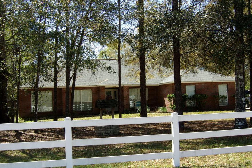 4 Bedroom, 2 Bath on one acre in Baker~ There is vinyl plank flooring in the foyer, kitchen, dining and the living room~  The bedrooms have friese carpet~  The kitchen has granite counter tops, stainless steel appliances and a large pantry in the breakfast area~  Formal dining and large great room~  Split floor plan~  Master bedroom has glass sliding doors opening to the large tiled deck~The back yard is completely privacy fenced~  AC is approx 5 years old~