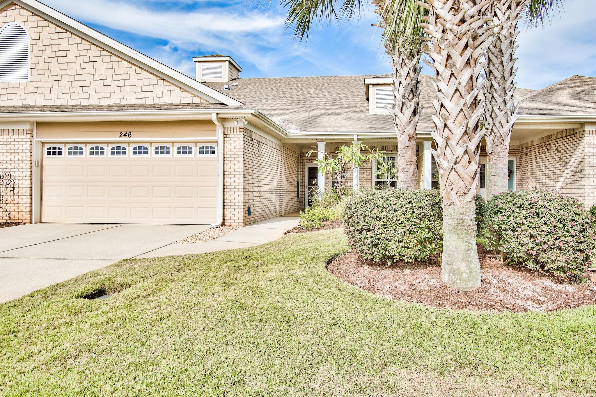 Located just three units from the pool, this impeccably maintained home is move-in ready, and is one of the few single story town homes in Destin and offers a 2 car garage! This is the larger floor plan at Diamond Lakes, and features include luxury vinyl plank flooring in the bedrooms with tile in the kitchen and living room, large walk-in master closet, attractive plantation shutters, stainless steel appliances, lots of cabinet and counter space, gas fireplace, vaulted ceiling in the living room, and screened-in back porch which is perfect for entertaining. The lake and walking path are located just across the street as well. Diamond Lakes is perfectly located in central Destin, and is just a half a mile to the beach. Also nearby are groceries, shopping, and restaurants that Destin is