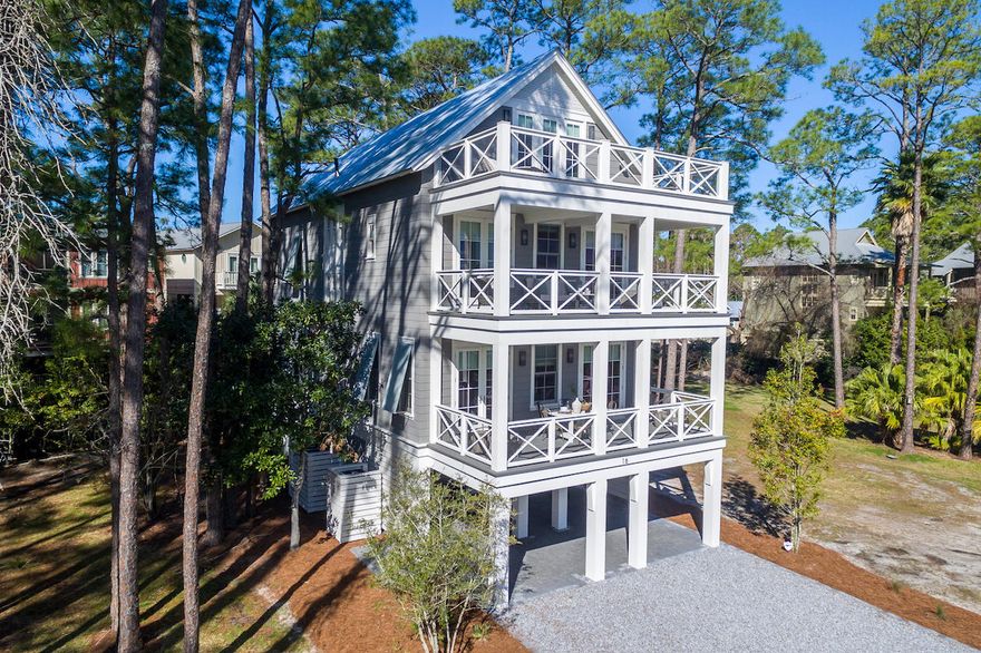 MODEL HOME ON PARCEL 3 IS PICTURED. THIS IS A ''TO BE BUILT'' OPPORTUNITY. This 5 bedroom, 5-1/2 bath fully furnished custom built home is a family or investors dream. This exquisite Magnolia Floor Plan custom built by local builder Luke & Blue boasts almost 3600 SqFt of living space and spectacular views of one of the most beautiful coastal dune lakes. Each floor of this home provides impressive views of Western Lake all while overlooking the community swimming pool area. Open concept living is truly represented in this home. Behold the lake views as you enter the 2nd floor into the inviting custom built kitchen.