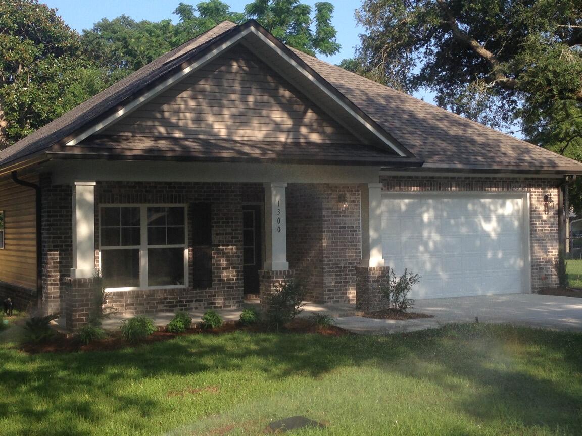 Tucked away on a quiet street in the heart of Niceville, this charming 3-bedroom, 2-bathroom home offers comfort, style, and smart design all on a single level. Whether you're just starting out, growing a family, or looking to downsize without compromise, this well-maintained residence has it all.Step up to a welcoming covered front porch, where classic brick accents and elegant columns set the tone for what's inside. Enter through the foyer and notice the durable, hand-scraped laminate wood flooring -- attractive and built to last.To the left, a hallway leads to two spacious guest bedrooms, each featuring Mohawk brand carpet, 9-foot ceilings, and stylish lighting. Between them, a fully equipped hall bath boasts a granite-topped vanity and a tub/shower combo -- ideal for guests or kids. Back through the foyer, the heart of the home unfolds with an open-concept kitchen, dining, and living area perfect for both everyday living and entertaining. The kitchen impresses with rich wood-stained cabinetry with crown molding, granite countertops, and stainless steel appliances, including a range, microwave, and dishwasher. A central island with undermount sink and pendant lighting creates a warm gathering space for meals or casual chats.
From the kitchen, enjoy a panoramic view of the living room and backyard through large, double-pane windows. A cozy dining area sits just to the side with easy access to the covered back patio, ideal for summer grilling or morning coffee.
Off the kitchen, a small hallway leads to a laundry room, storage closet, and access to the attached two-car garage. On the opposite side of the home, privacy awaits in the owner's suite. This peaceful retreat features a walk-in closet, a second standard closet, and an en-suite bath with raised-height double vanity, granite countertops, a soaking garden tub, and a separate walk-in shower.
Additional highlights include:
Completely fenced backyard perfect for kids or pets
Irrigation system in place for easy lawn care
Manabloc plumbing system for efficient water use
R-38 blown insulation and energy-efficient appliances for lower utility costs
Located just minutes from schools, parks, shopping, and dining this home truly checks every box.
Schedule your private showing today homes in this desirable Niceville location don't last long!