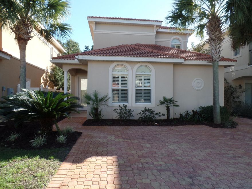 No Garage, but plenty of room for 2 cars in the driveway! This beautiful home is located in Calusa Bay; a private, gated-community in Destin! This home offers a highly desired first floor master suite and a large master closet with built-in shelving. The master bath has double vanity sinks, a jetted tub and separate shower. The soft neutral colors and well-designed plan make you feel at home immediately. There are custom plantation shutters in all windows. The home is hardwired with a security system, network cables, and audio wiring for surround sound in the living room. The kitchen is any chef's delight with granite countertops, beautiful cabinetry and under cabinet lighting. Upstairs you will find two additional bedrooms with a private balcony and a large guest bathroom.