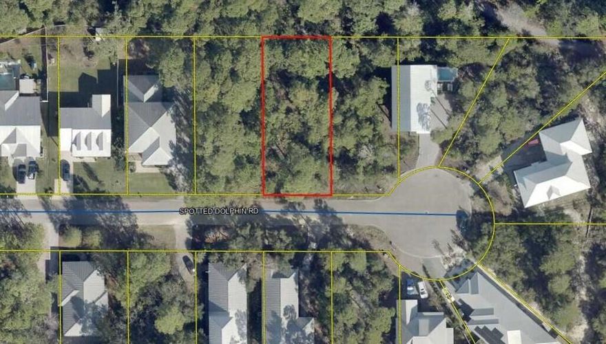 Beautiful wooded lot on the West end of 30a.  Spotted Dolphin is a quiet tree lined one street neighborhood with close proximity to several beach access points and Butler Elementary.  This lot would be a wonderful home site for full time, secondary or vacation home.
