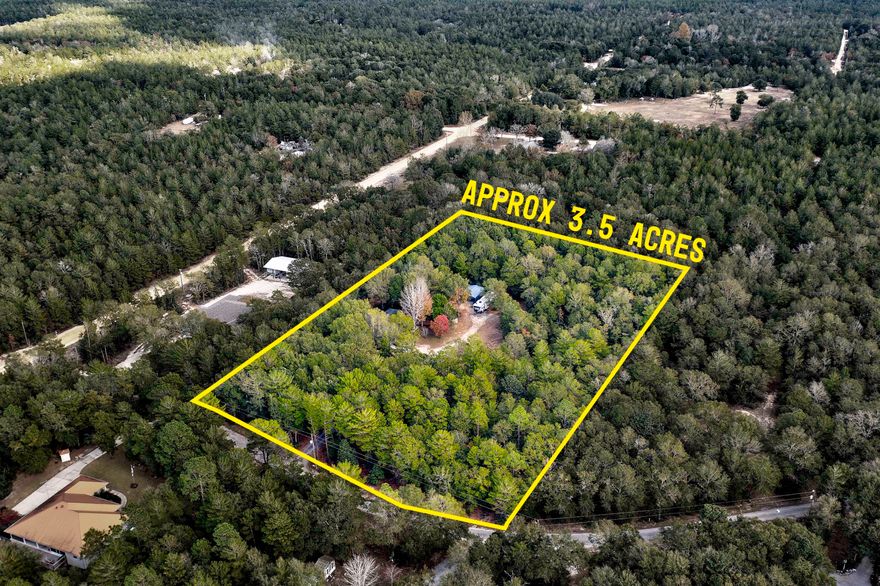 A rare find in today's market. This 3 bedroom 2.5 bathroom home is located on 3.5 acres under $280k.You don't want to miss this opportunity. This beautiful freshly painted home has 2 owner suites with full bathrooms. The kitchen has a walk in pantry and is fully equipped with stainless steel appliances with a very large breakfast bar. The main living area features 2 living room areas and a dining area. The front door of the home has a covered screened in porch. The back of the home features a Florida room with a entry door that takes you to the back yard and a covered porch. The fenced in portion of the back yard is newly sod and looks amazing.