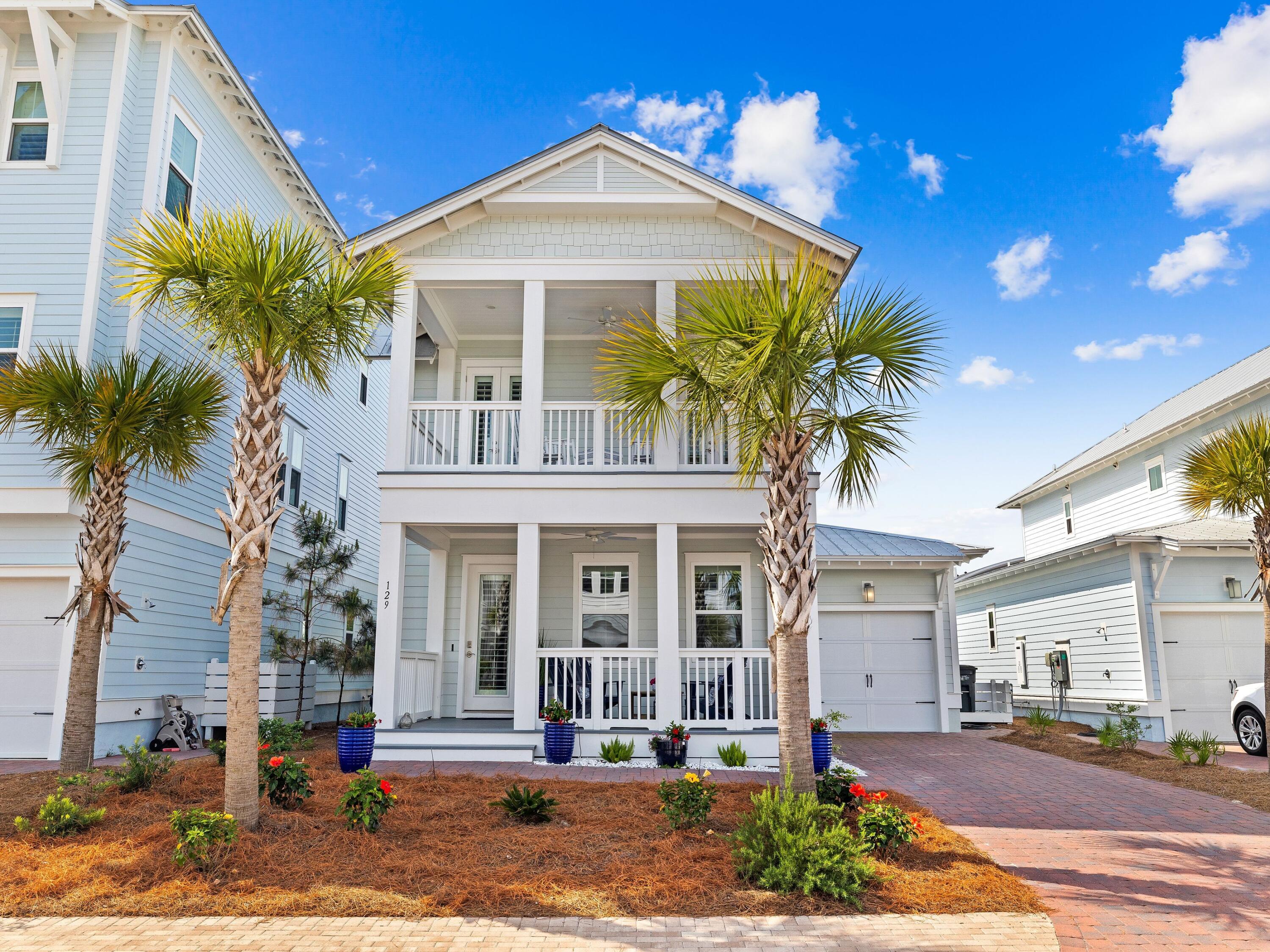 Indulge in coastal luxury with the Maldives plan, boasting impeccable craftsmanship and upscale finishes in the esteemed community of Prominence South. From the moment you arrive, the charm is evident with HardiPlank siding, a metal roof and welcoming brick pavers adorning the driveway and walkway. Step inside to discover an interior adorned with hardwood floors throughout the main level, upstairs hallway and bedrooms, while sleek tile graces the wet areas. Smooth finish ceilings, brushed nickel hardware and elegant 8-ft. interior doors add to the allure. Luxury awaits in the kitchen, complete with quartz countertops, a gas cooktop, stainless steel appliances and a convenient wet bar.
