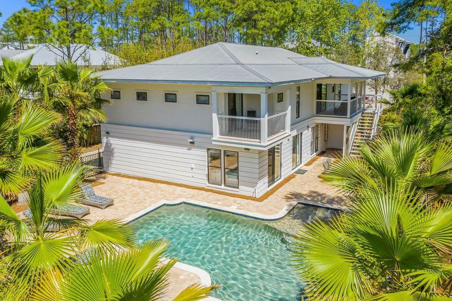 This Canal Street Beach Cottage, aptly named ''Beside Seaside'', is ideally located in Seagrove Beach just steps from Seaside, Public Beach Access and all that 30A has to offer on a coveted private lot! With approximately 3800 square feet, the 6 bedroom (+2 bunk room) home is ideal for a rental investment or a large family retreat. The exterior of the home is manicured with lush tropical landscape which creates a sense of privacy. The second level hosts the spacious kitchen open to the dining area and living room filled with natural light from the vaulted windows. In addition, on this level, you will find the owner's suite with private balcony, 3 guest suites and one of two laundry rooms. Level one provides 2 additional guest suites, 2 bunk rooms, a morning kitchen, the 2nd laundry room