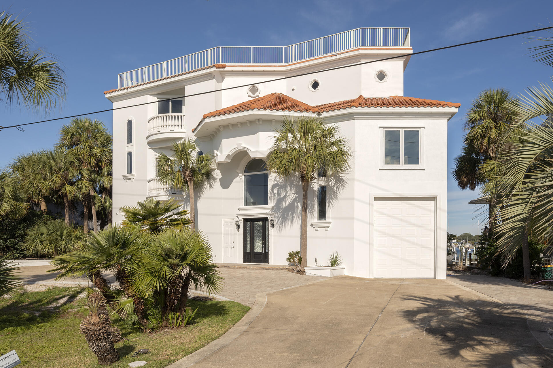 Completely Remodel & Upgraded 10 Bedroom, 13.5 Bath, 5,458SF Harbor Front Home with Harbor View from Almost Every Room & a Roof Top Terrace with Gulf Views. The first floor features a large great room with full bath and access to the pool, outdoor kitchen, & dock. Down the hall there is a large bunk room with two full baths and a bedroom with private bath & access to the pool area. The 2nd Floor features a large open living, dining, kitchen area with half bath & large balcony. There are also 3 large bedrooms with private baths and gorgeous views. The 3rd floor feature 5 bedrooms with private baths and amazing views. Other features include 2 additional balconies, elevator, garage, & rooftop terrace. This would make an amazing rental or family get away.  Don't let this home pass you by.