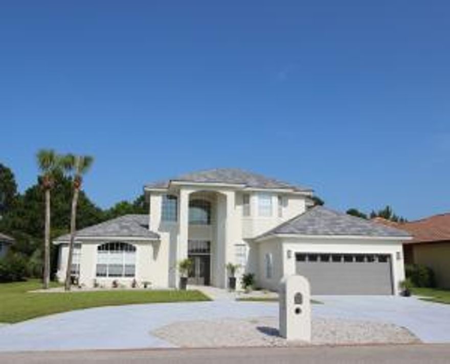 Beautiful pool and spa! Behind the gates of the Emerald Bay Golf and Country Club sits this beautifully updated, contemporary family home with a 2018 pool/spa! This beautiful home underwent a recent renovation to include, but not limited to a new tile roof, all new paint inside and outside the home, new landscaping and sod, new hardwood floors throughout the first level of the home, new carpet and tile upstairs, exotic granite counter tops throughout, all new designer plumbing and lighting fixtures that are to die for, custom glass back splash and new stainless appliances that are a chef's dream in the kitchen, and new AC in 2015. The floor plan is excellent for family living and entertaining with the Master suite on the main level along with the great room
